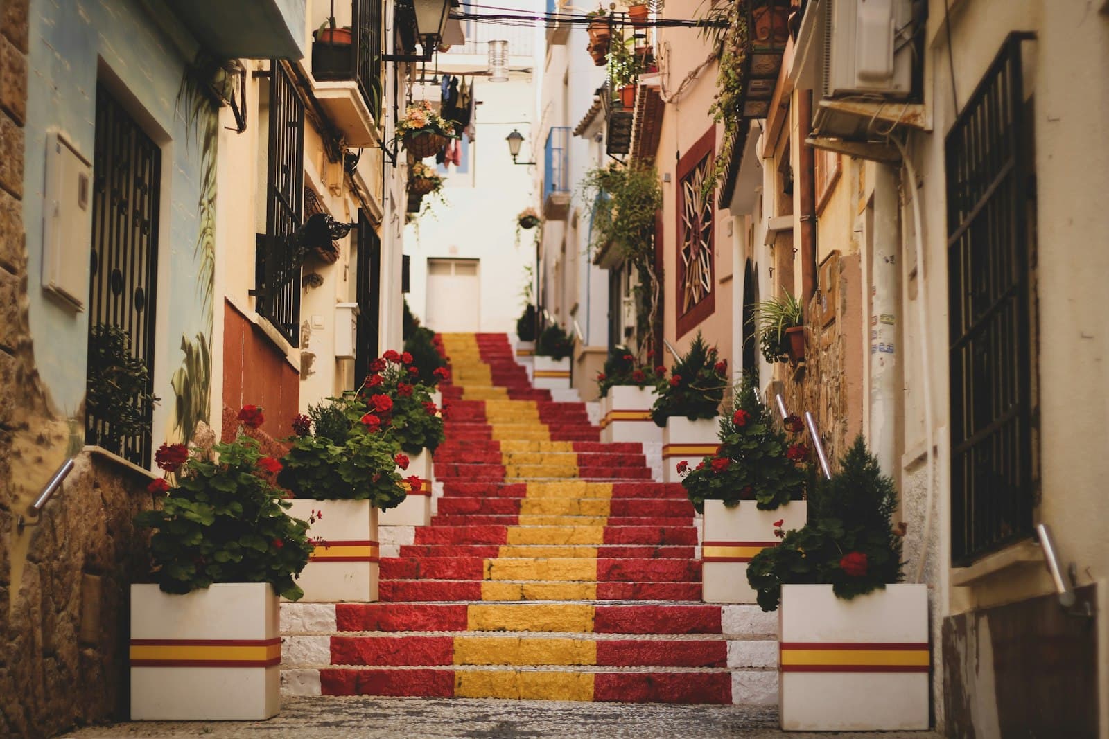 Palma de Mallorca — red, yellow, and white concrete stairs
