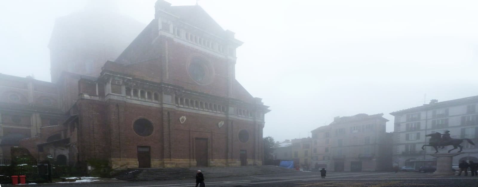 Pavia — people walking on sidewalk near building during daytime