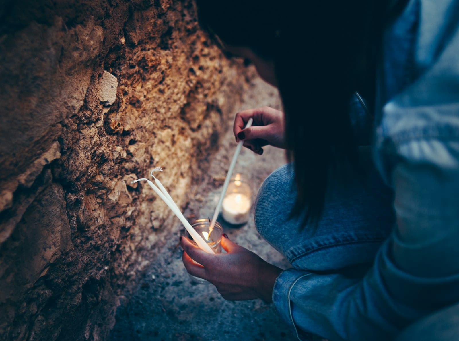 Pedraza — woman holding white pillar candles