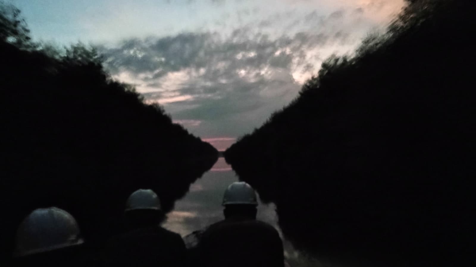 Pekanbaru — a couple of people that are standing in the dark