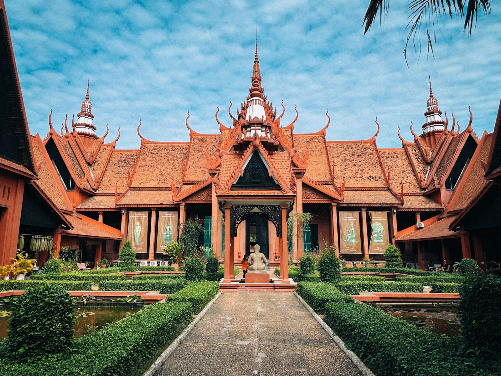 Phnom Penh — a building that has a lot of plants in front of it