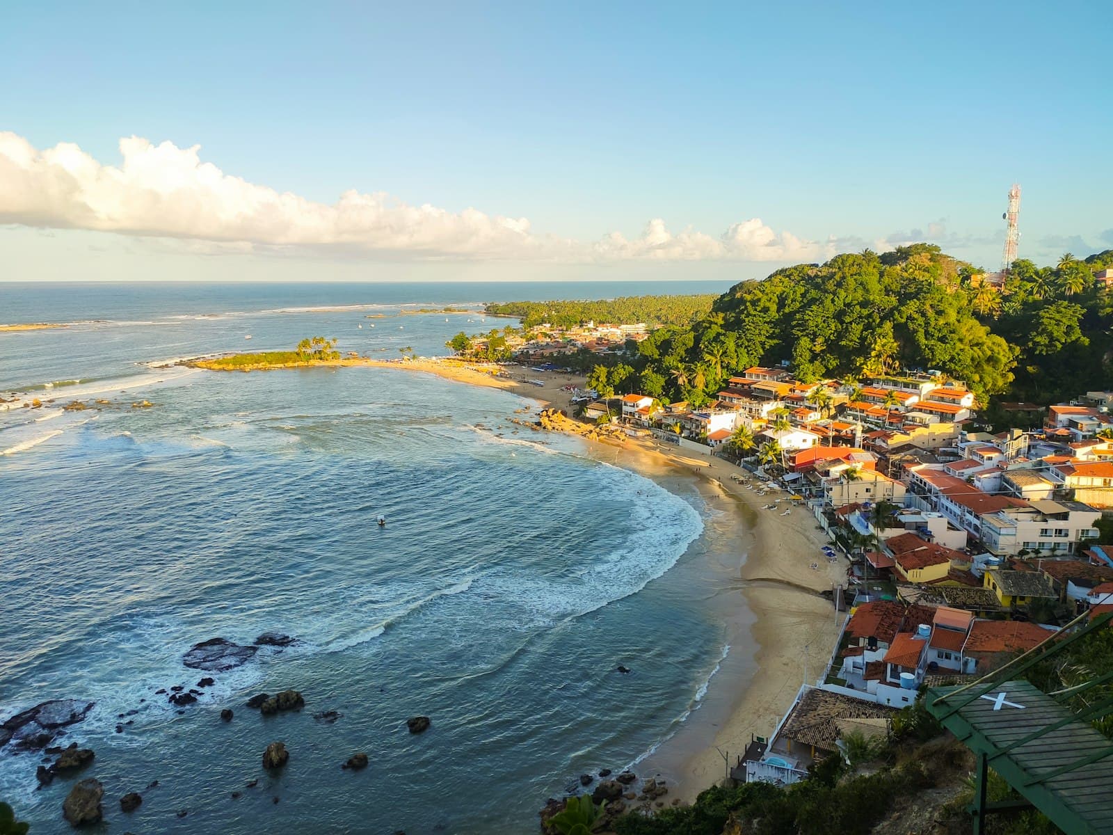 Pipa — aerial view of city near sea during daytime