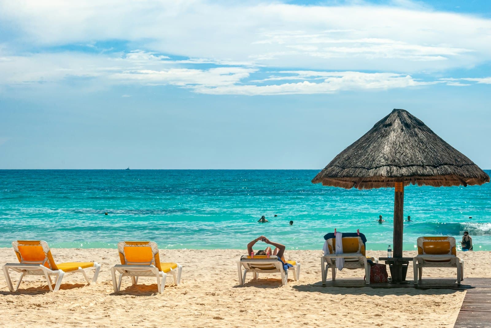 Playa del Carmen — brown beach umbrellas on beach during daytime