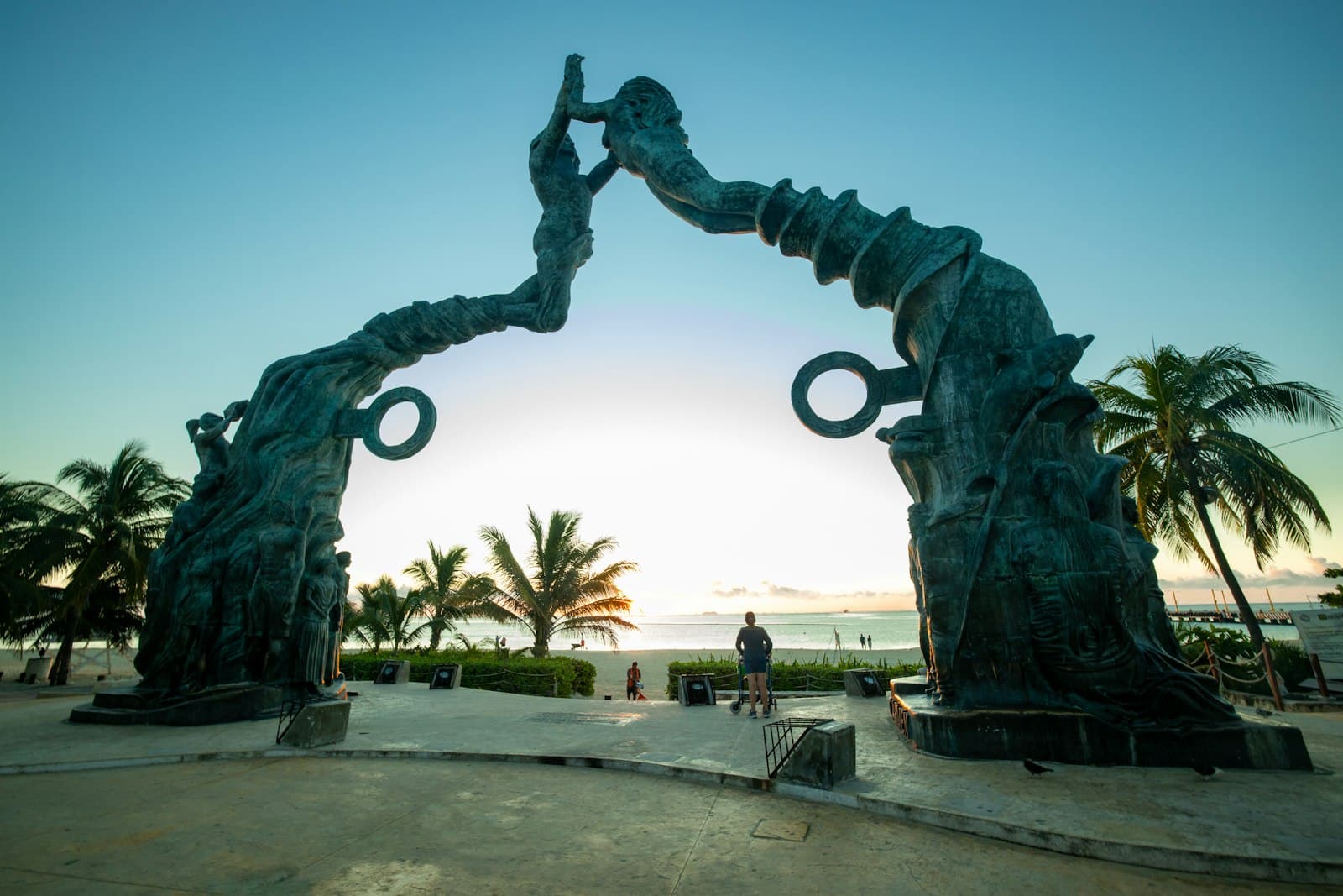 Playa del Carmen — man in black jacket standing statue