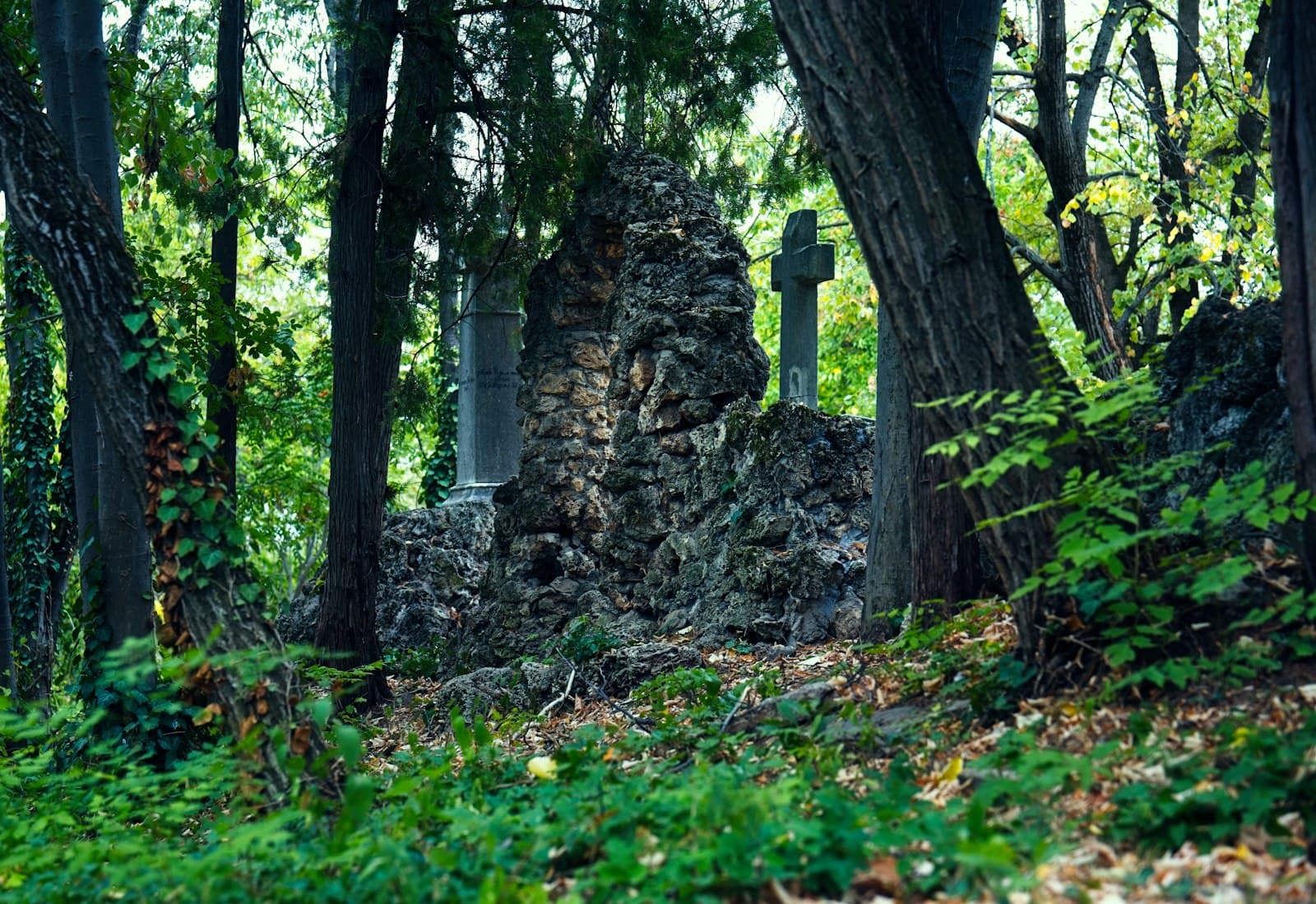 Pleven — Stone monument with cross in overgrown forest