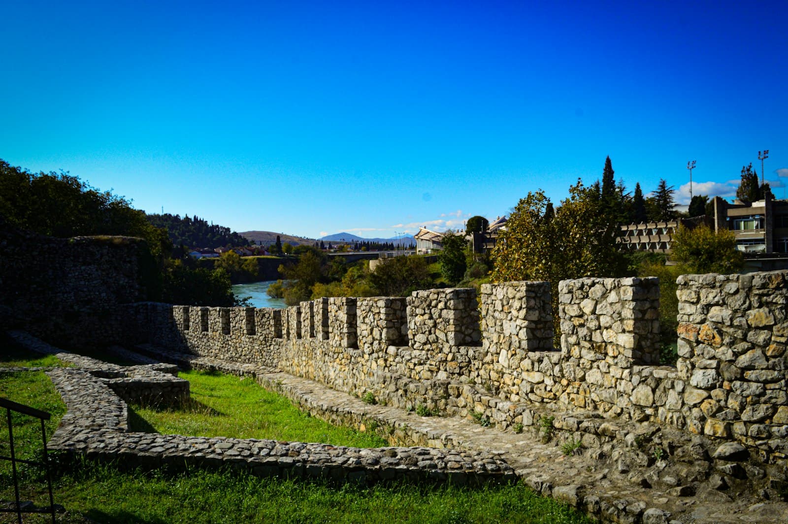 Podgorica — a stone wall next to a body of water