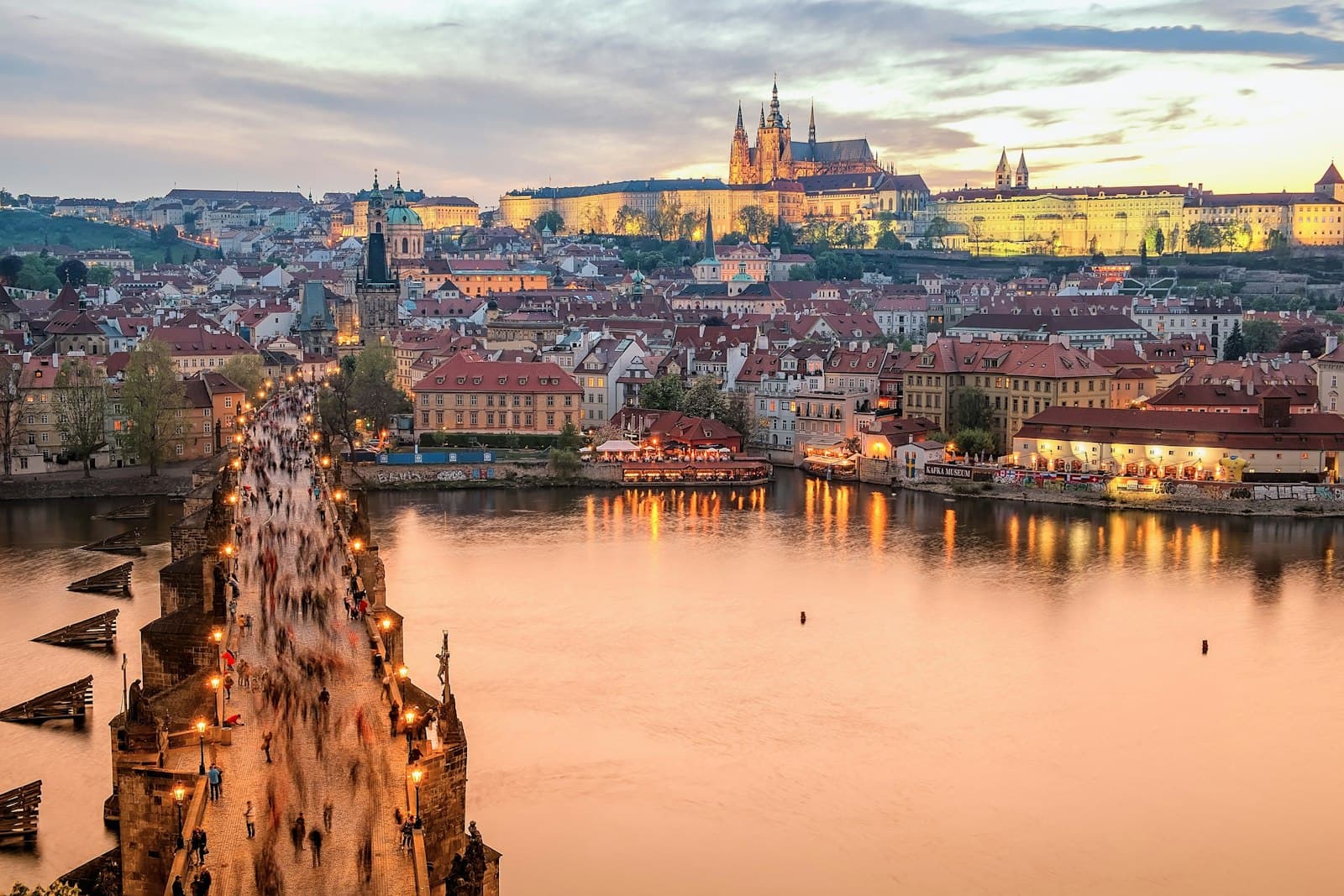 Prague — brown concrete building near body of water during daytime