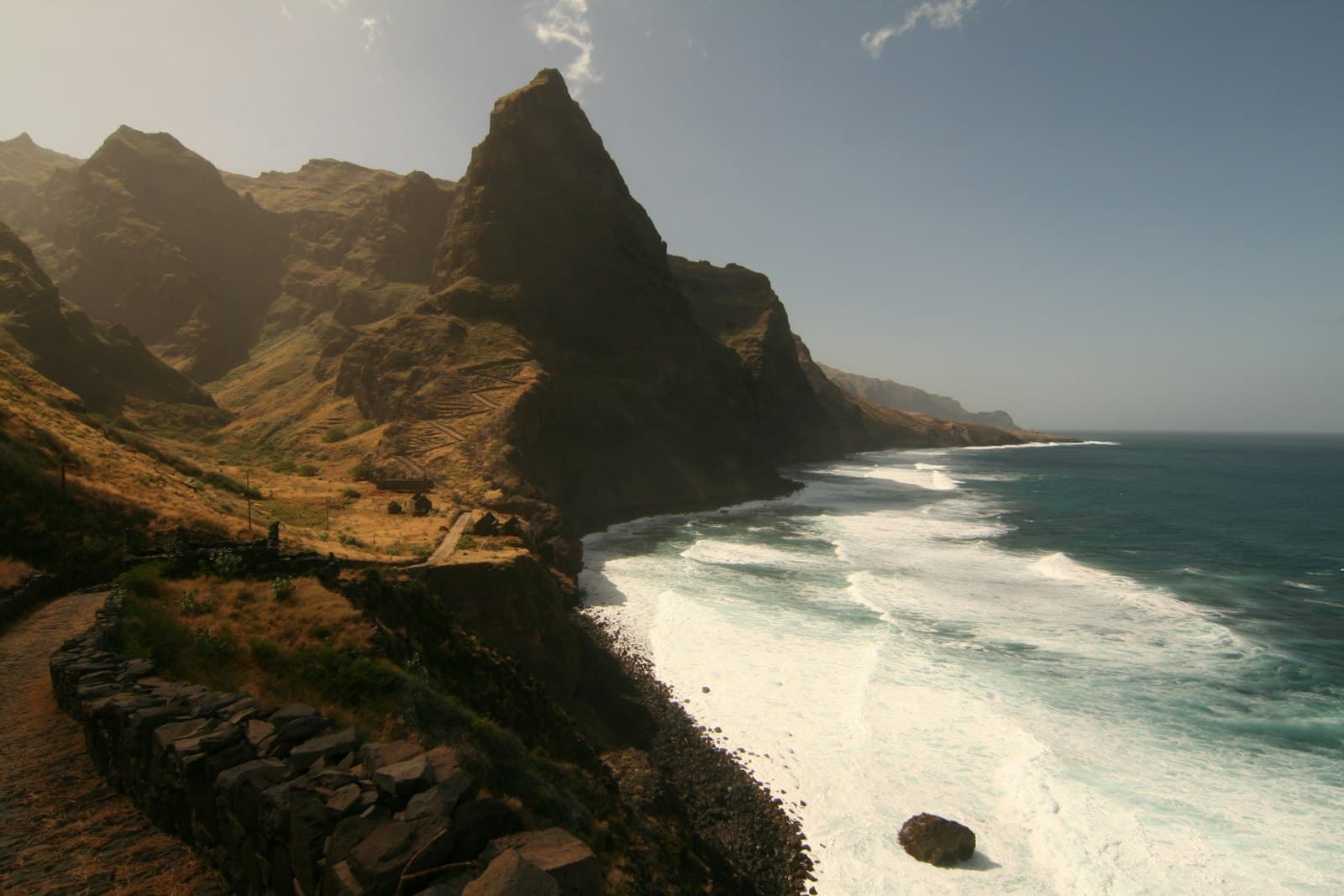Praia — a scenic view of the ocean and mountains