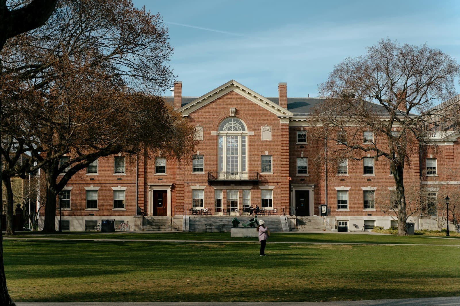 Providence — a person standing in front of a large brick building
