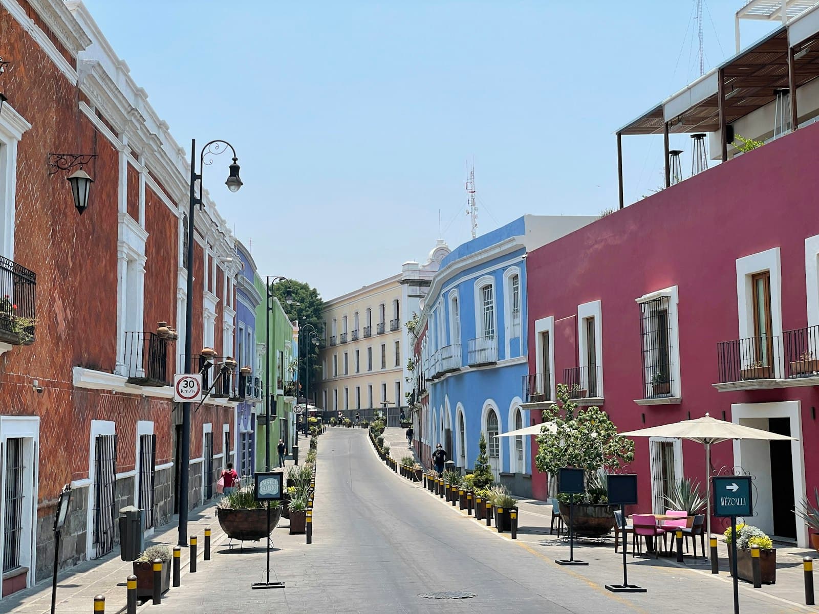Puebla — a street lined with colorful buildings and tables