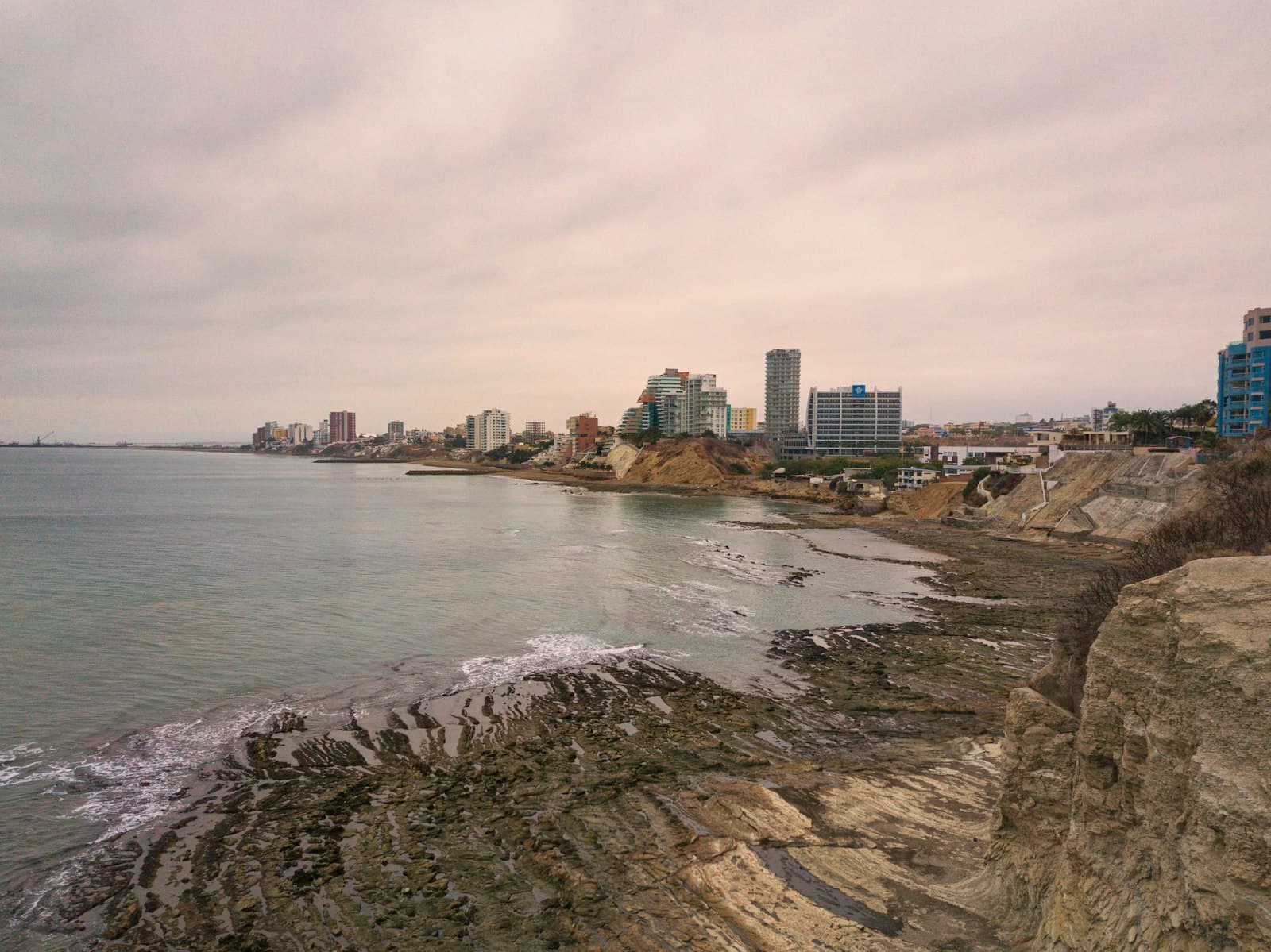 Puerto Baquerizo Moreno — city skyline near sea under cloudy sky during daytime