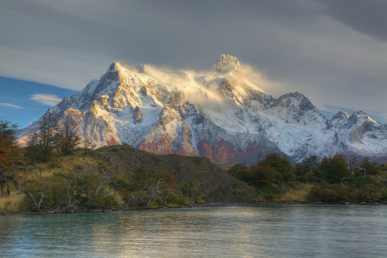 Puerto Natales — white mountain near lake painting