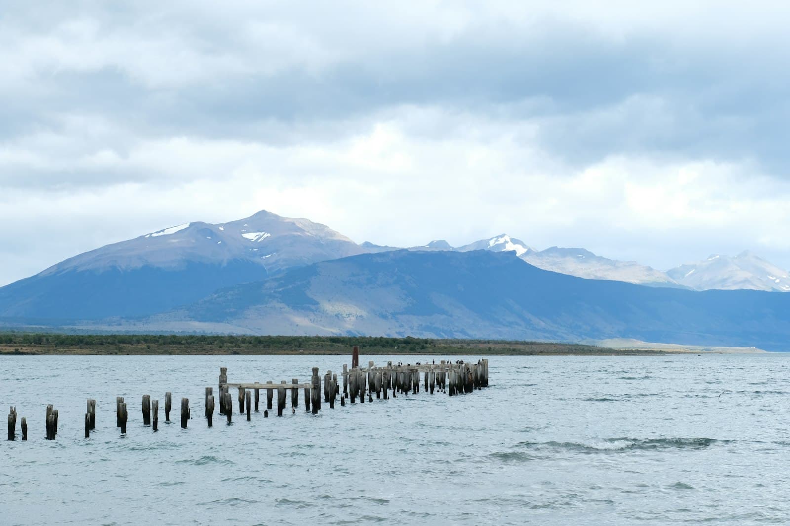 Puerto Natales — a large body of water with mountains in the background