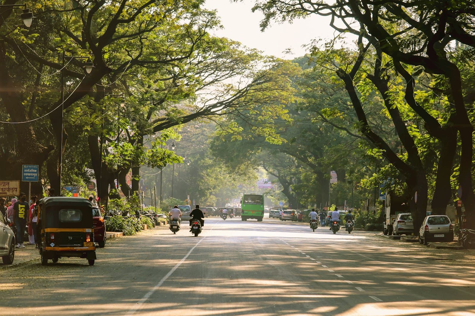 Pune — people walking on sidewalk during daytime