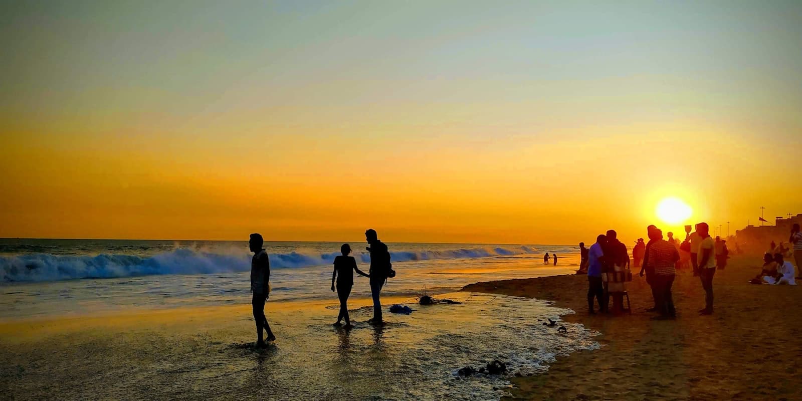 Puri — a group of people on a beach
