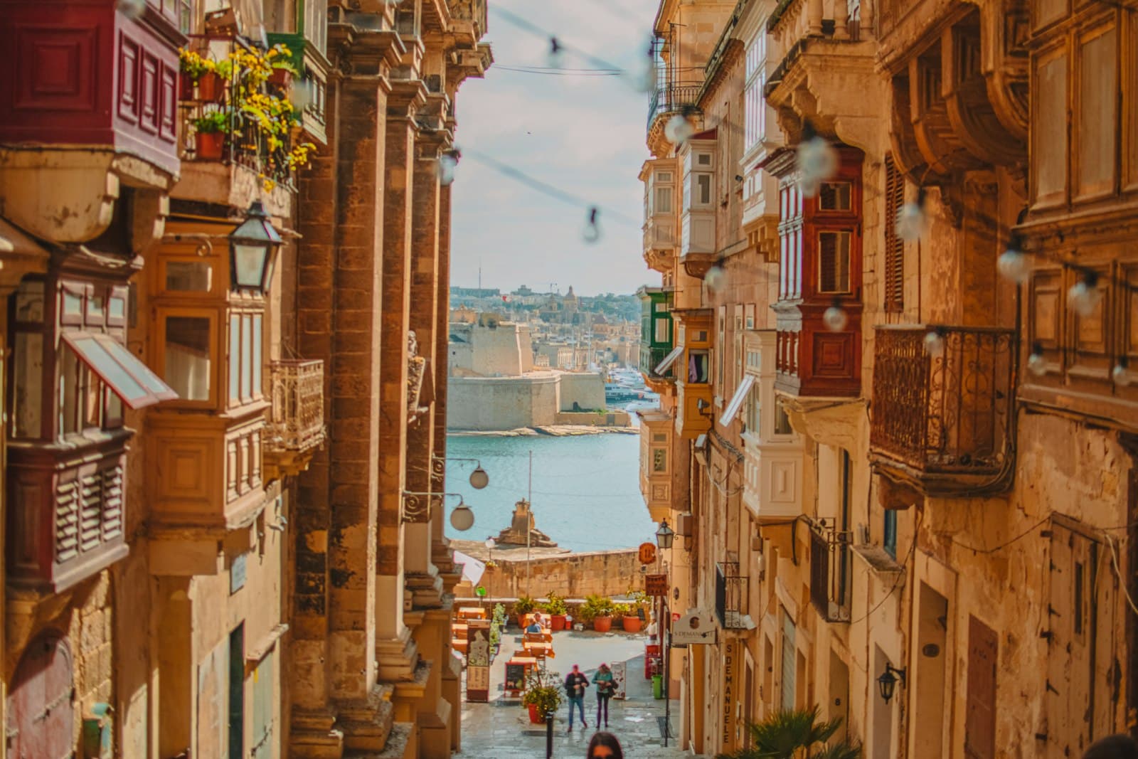 Qrendi — A narrow street in Valletta with traditional wooden balconies overlooking the Grand Harbour