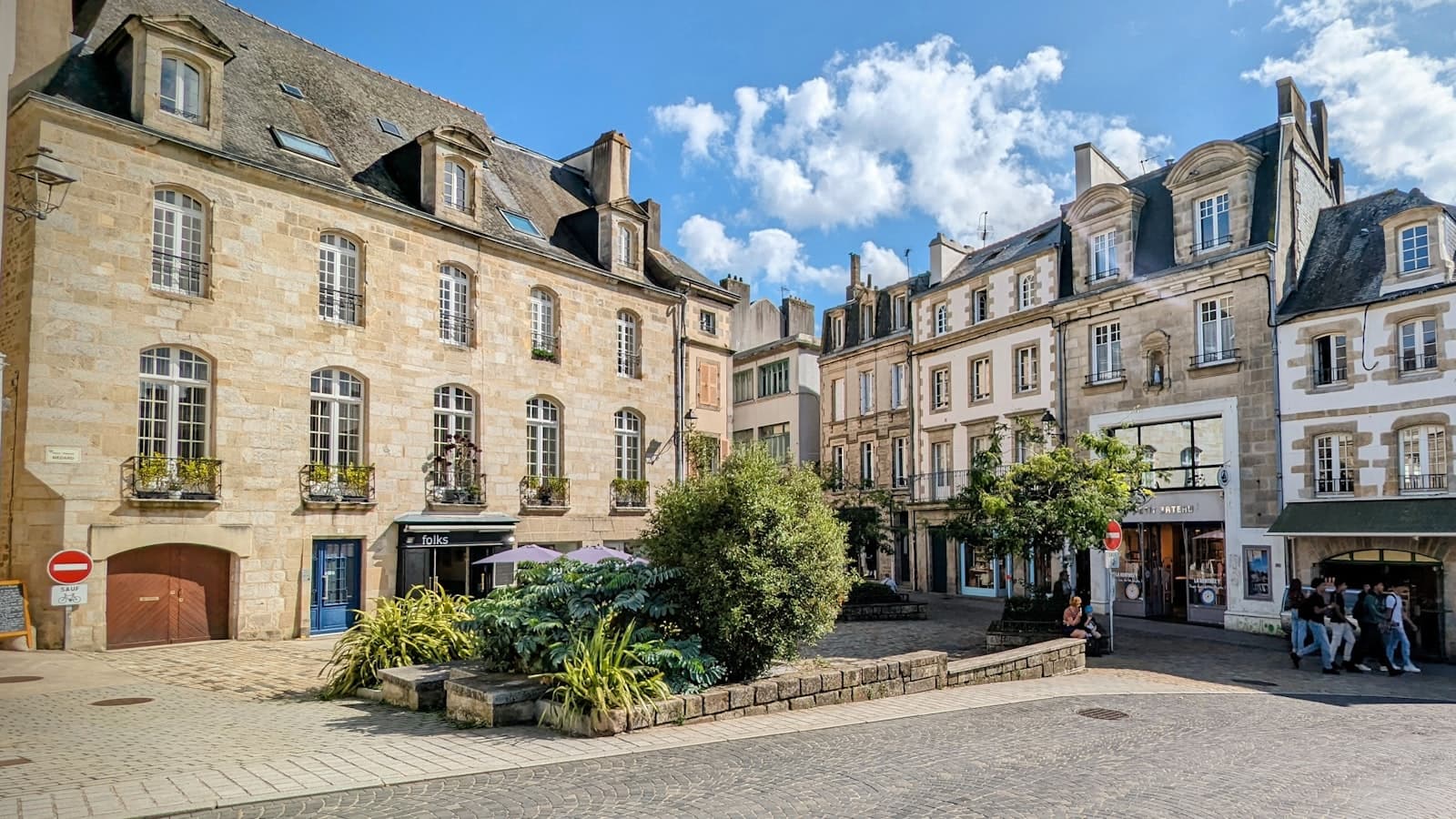 Quimper — a group of people standing outside of a building