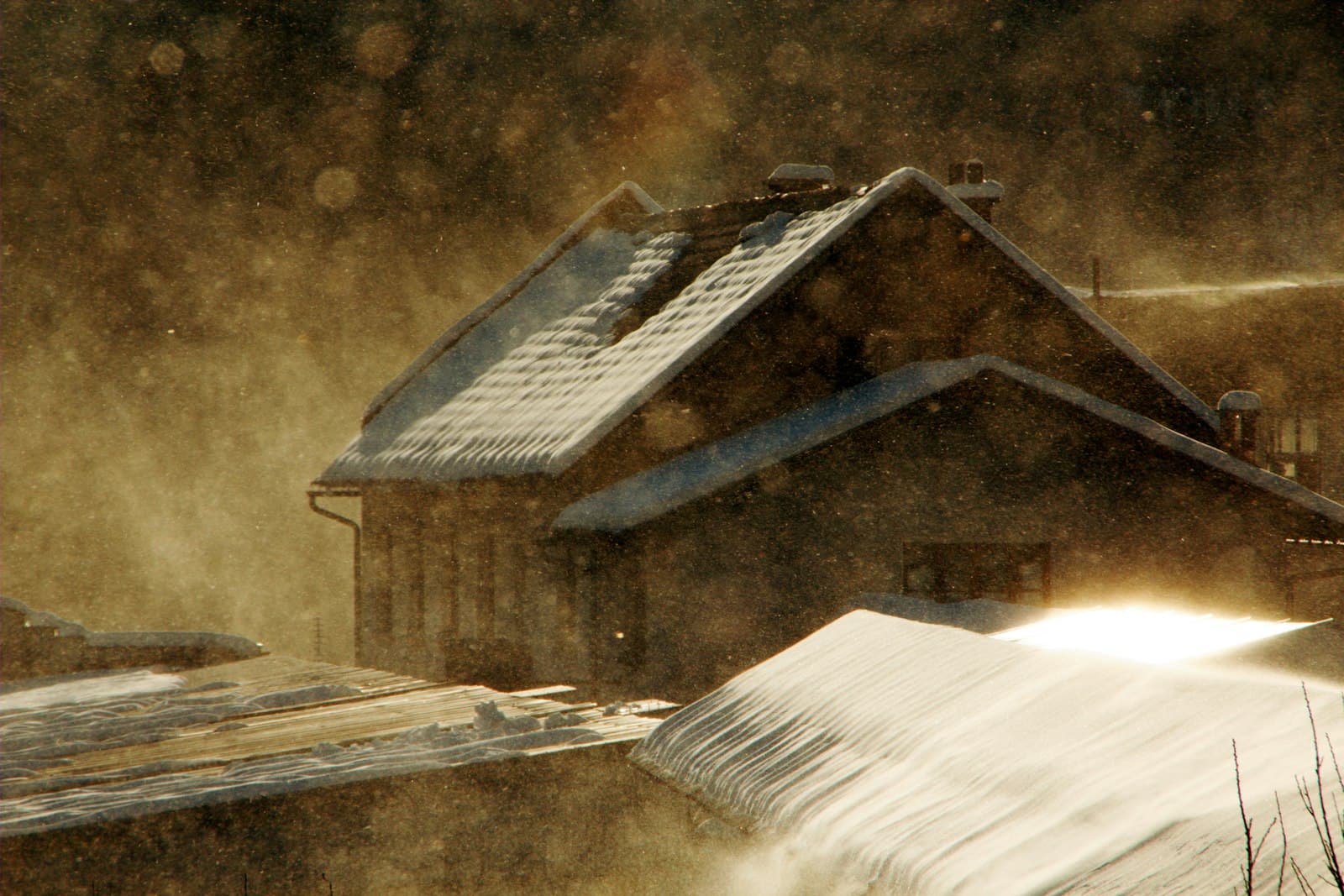 Radovljica — snow-coated brown house painting
