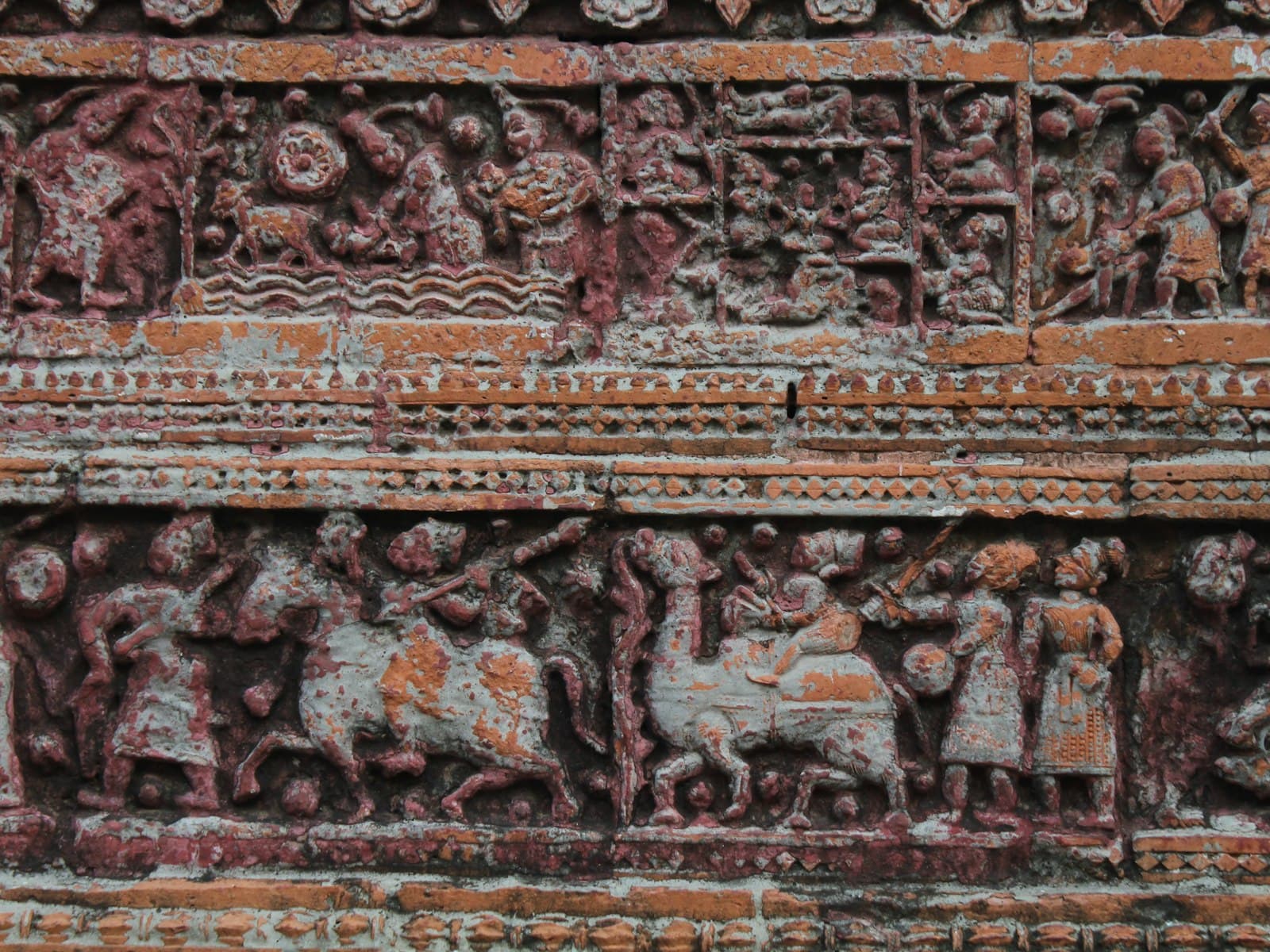 Rangpur — a close up of a carving on a wall
