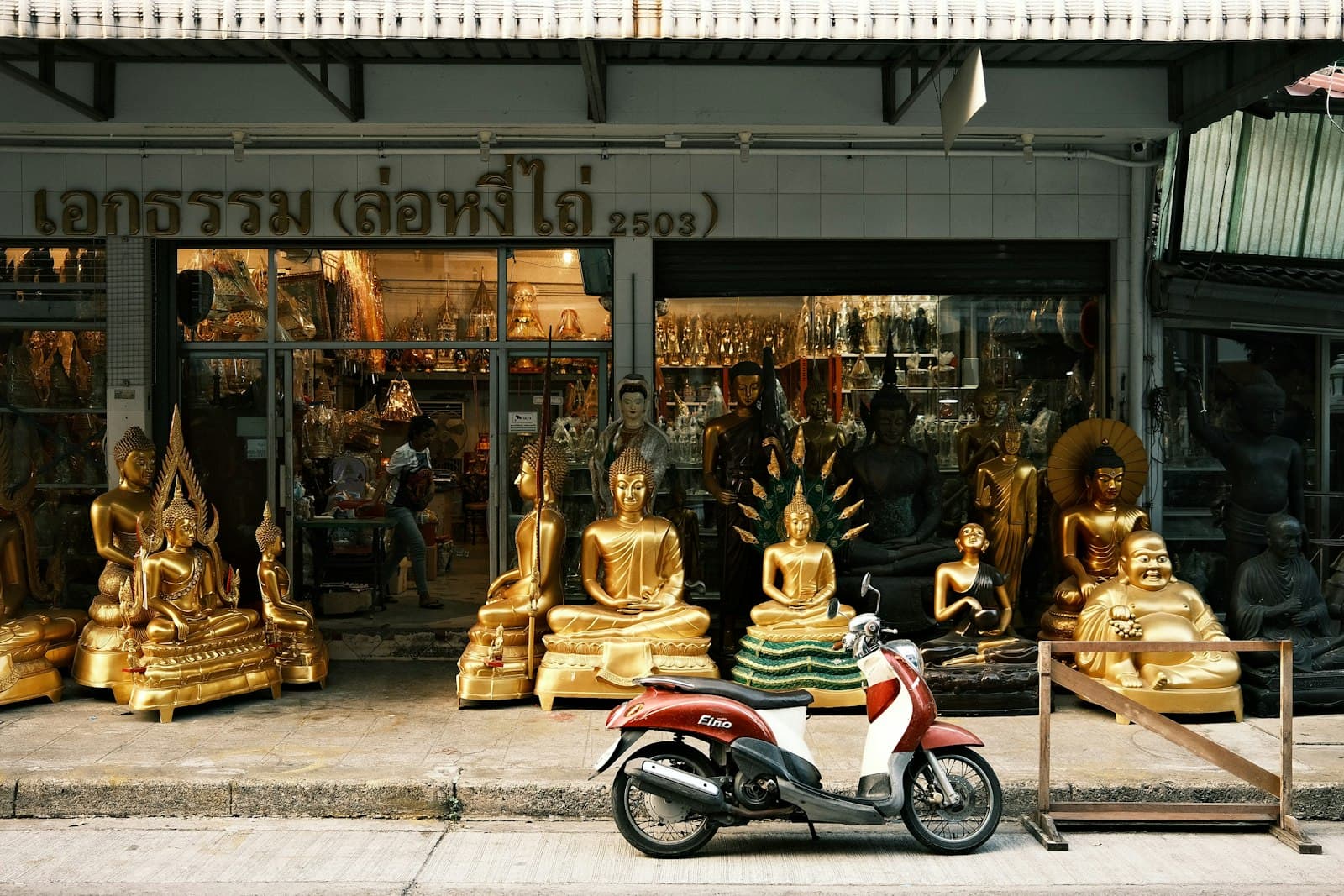 Ranong — a motor scooter parked in front of a store