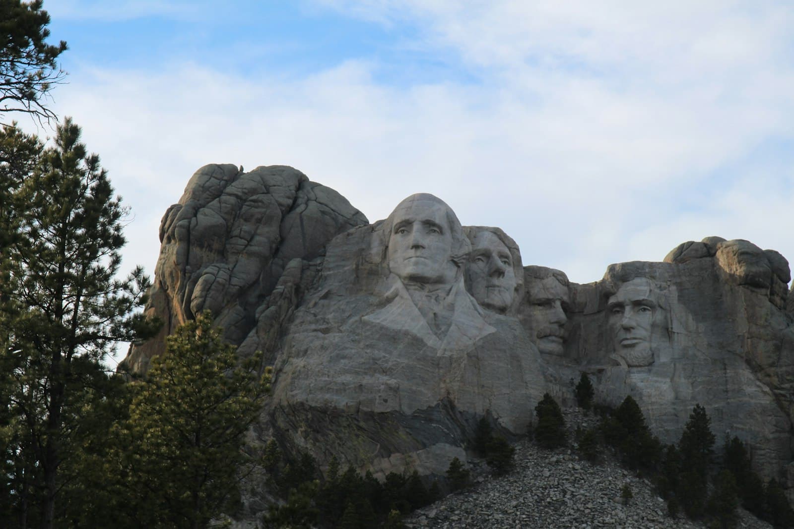 Rapid City — gray rock formation under white clouds during daytime