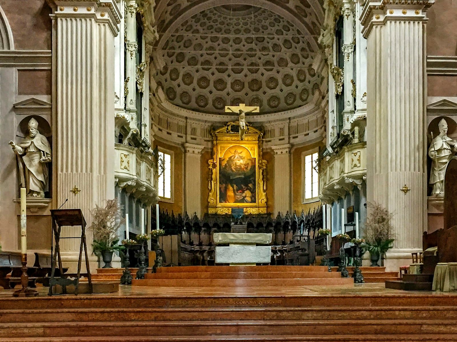 Reggio Emilia — brown wooden bench inside cathedral