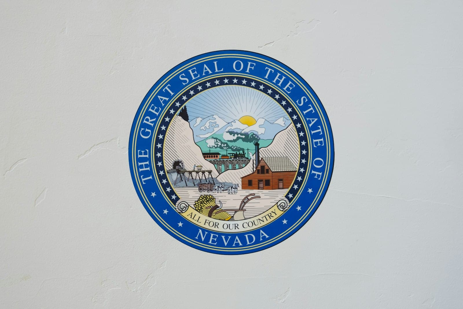 Reno — The Great Seal of the State of Nevada logo on white wall