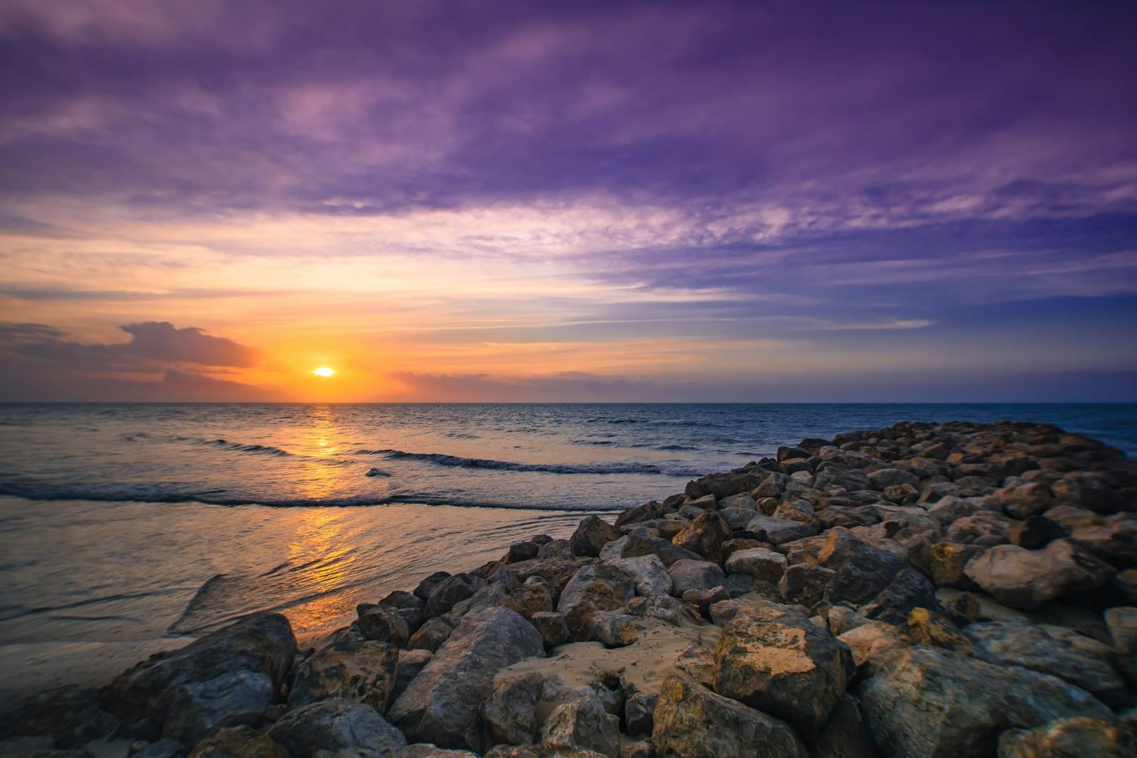 Riohacha — rocks and calm sea during golden hour