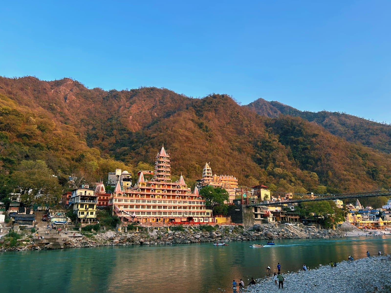 Rishikesh — a scenic view of a mountain town with a river running through it