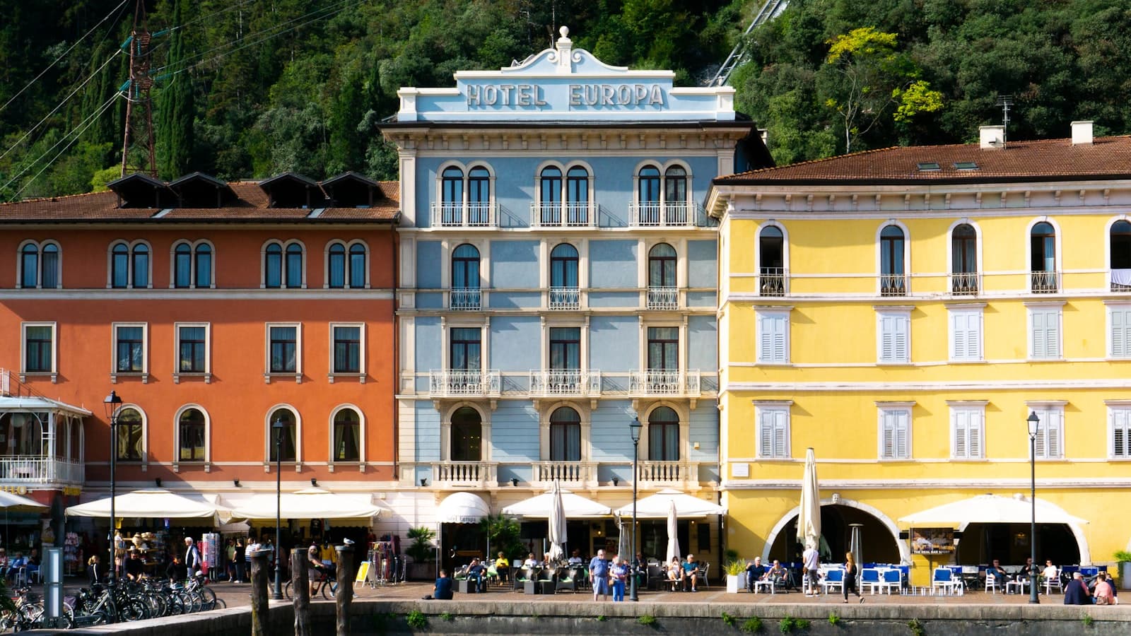 Riva del Garda — a group of buildings with people walking around