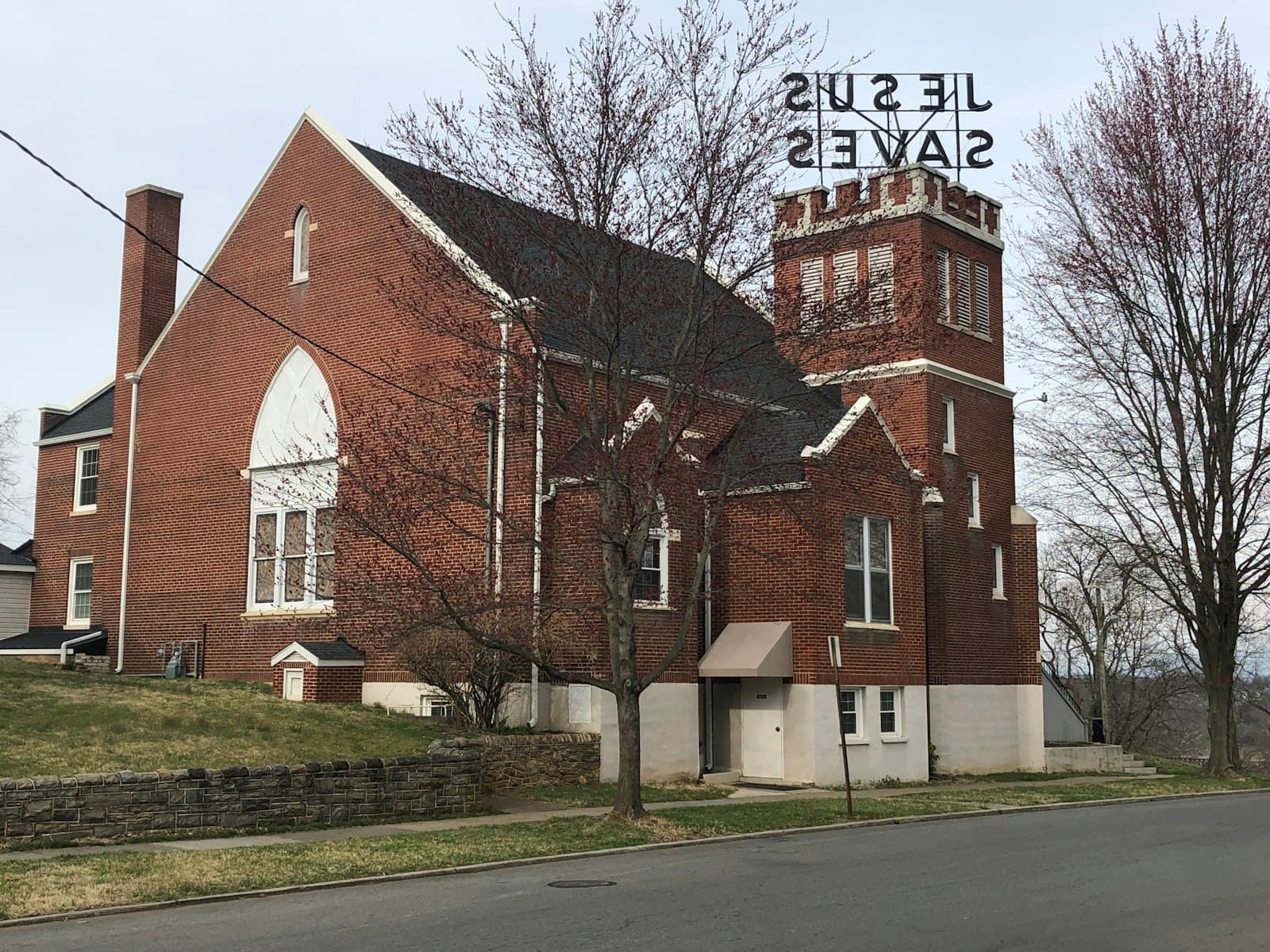 Roanoke — brown and white concrete building near bare trees during daytime