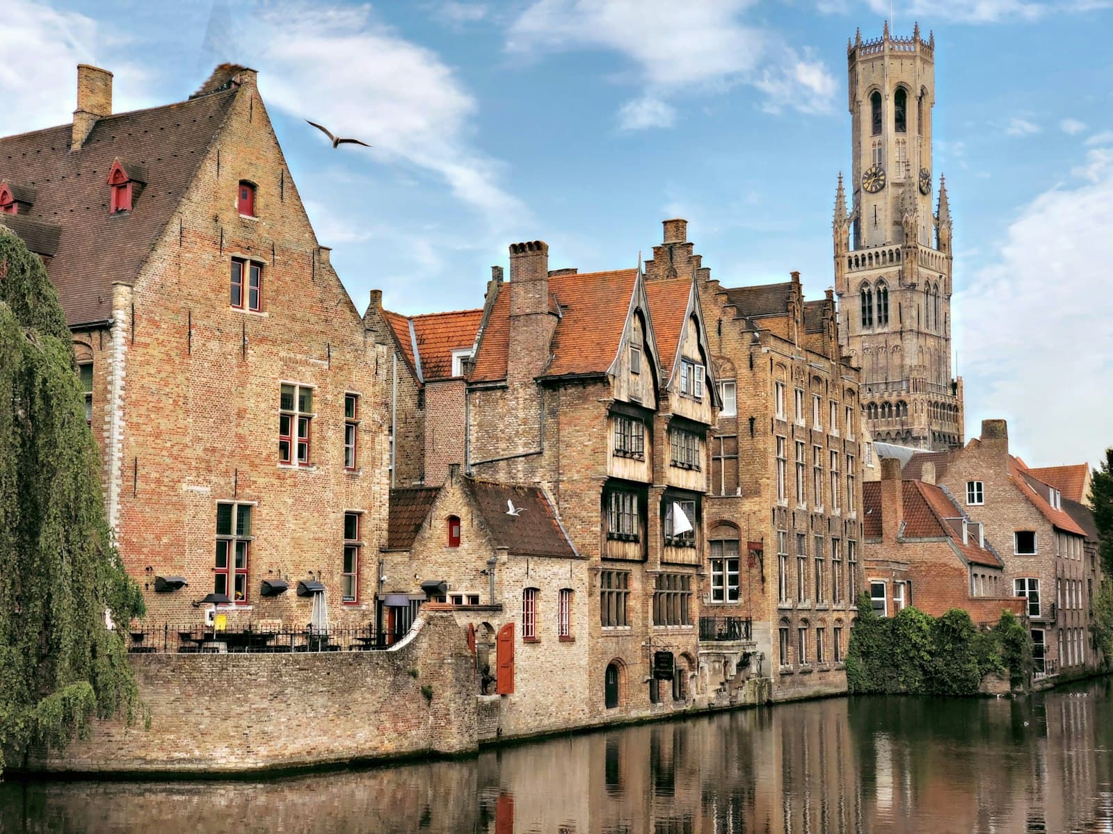Rochefort — brown concrete building beside river during daytime