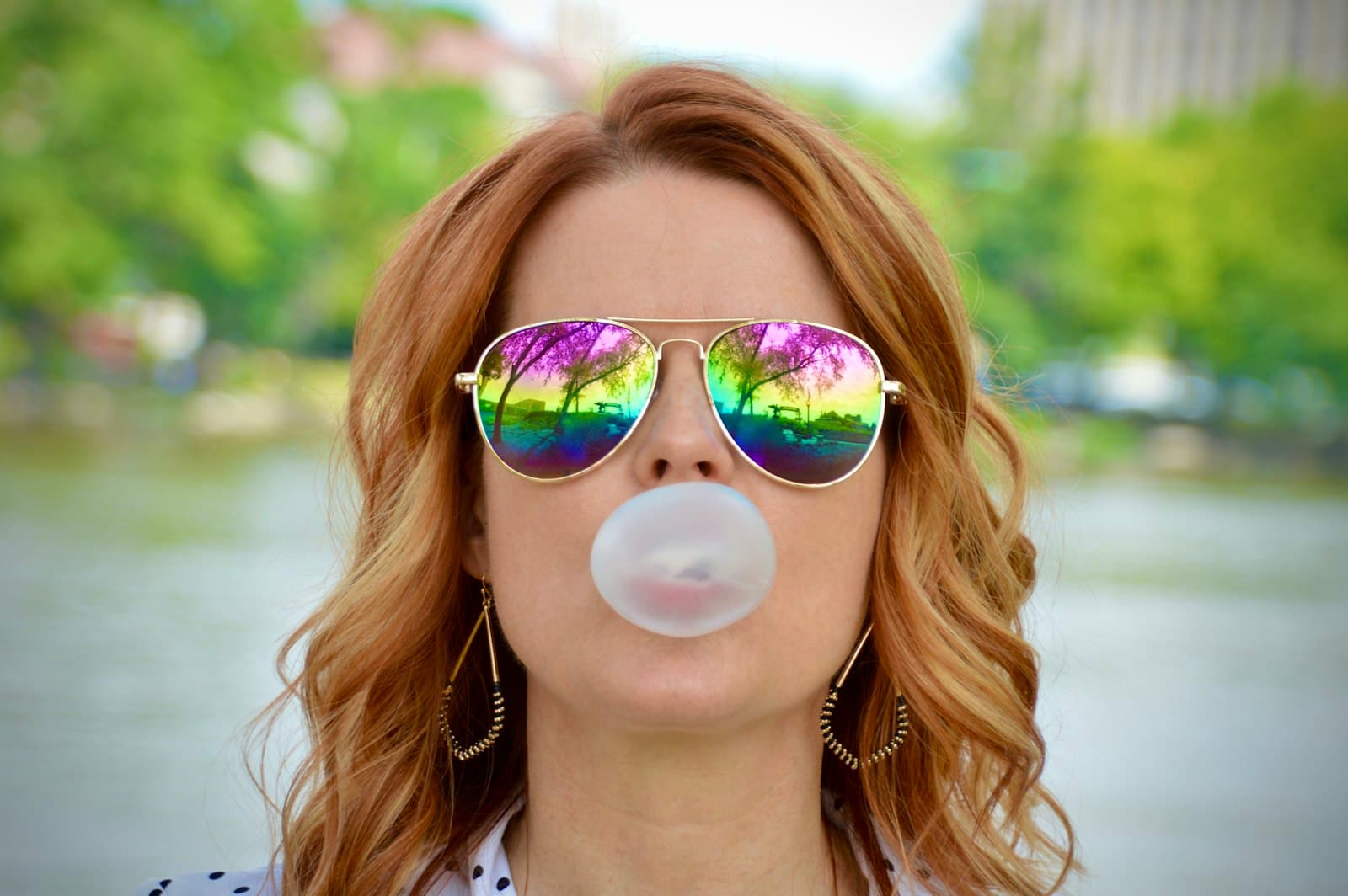 Rockford — a woman wearing sunglasses blowing a bubble