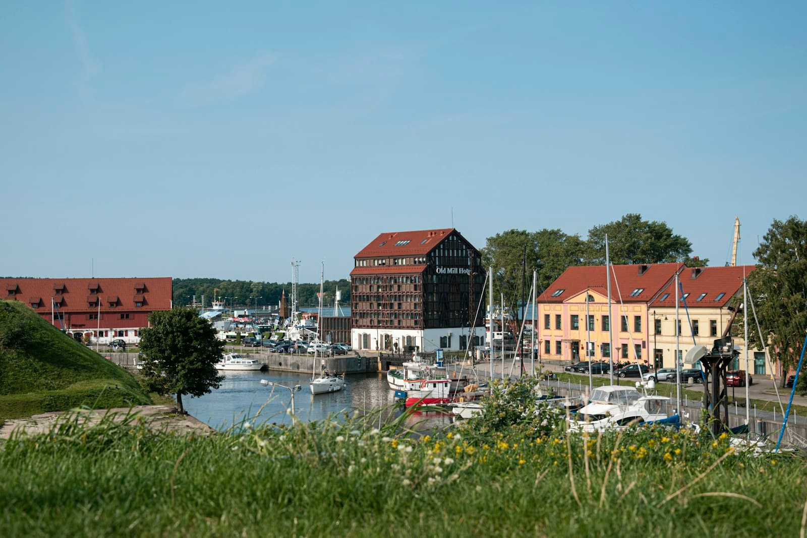 Rokiškis — red and white houses near body of water during daytime