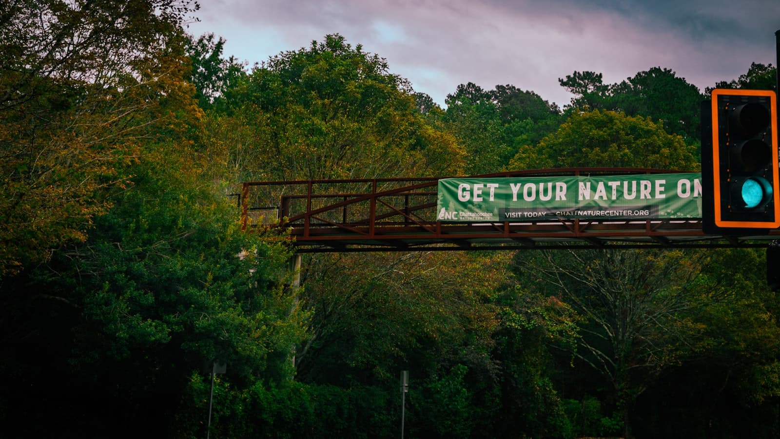 Roswell — a sign that reads get your nature on a bridge