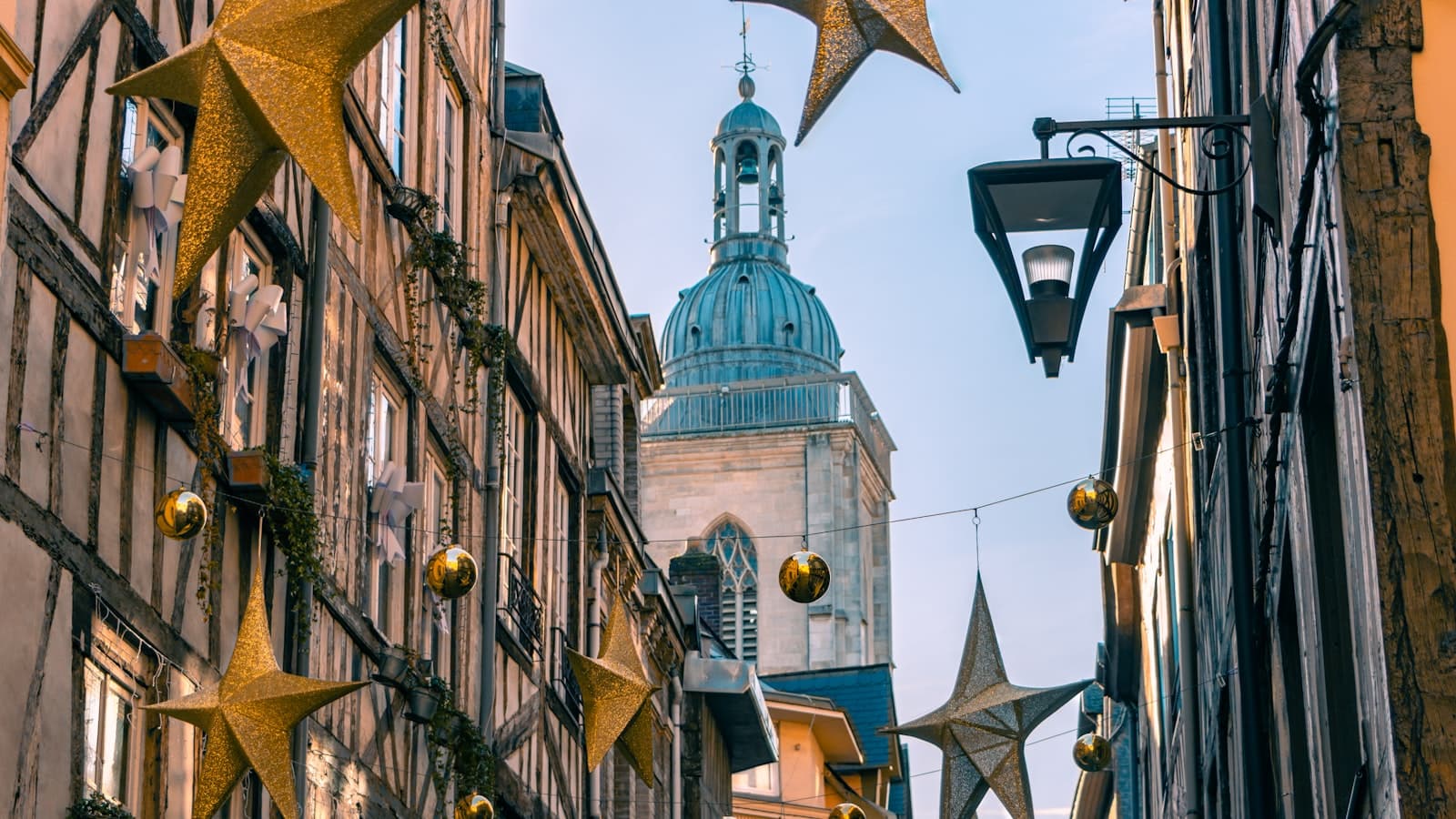 Rouen — a city street lined with tall buildings and christmas decorations