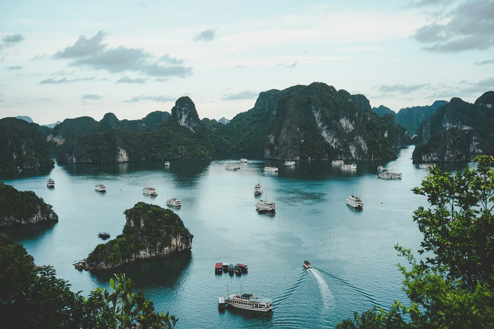 Sa Đéc — high-angle photography of boats on water near hill during daytime