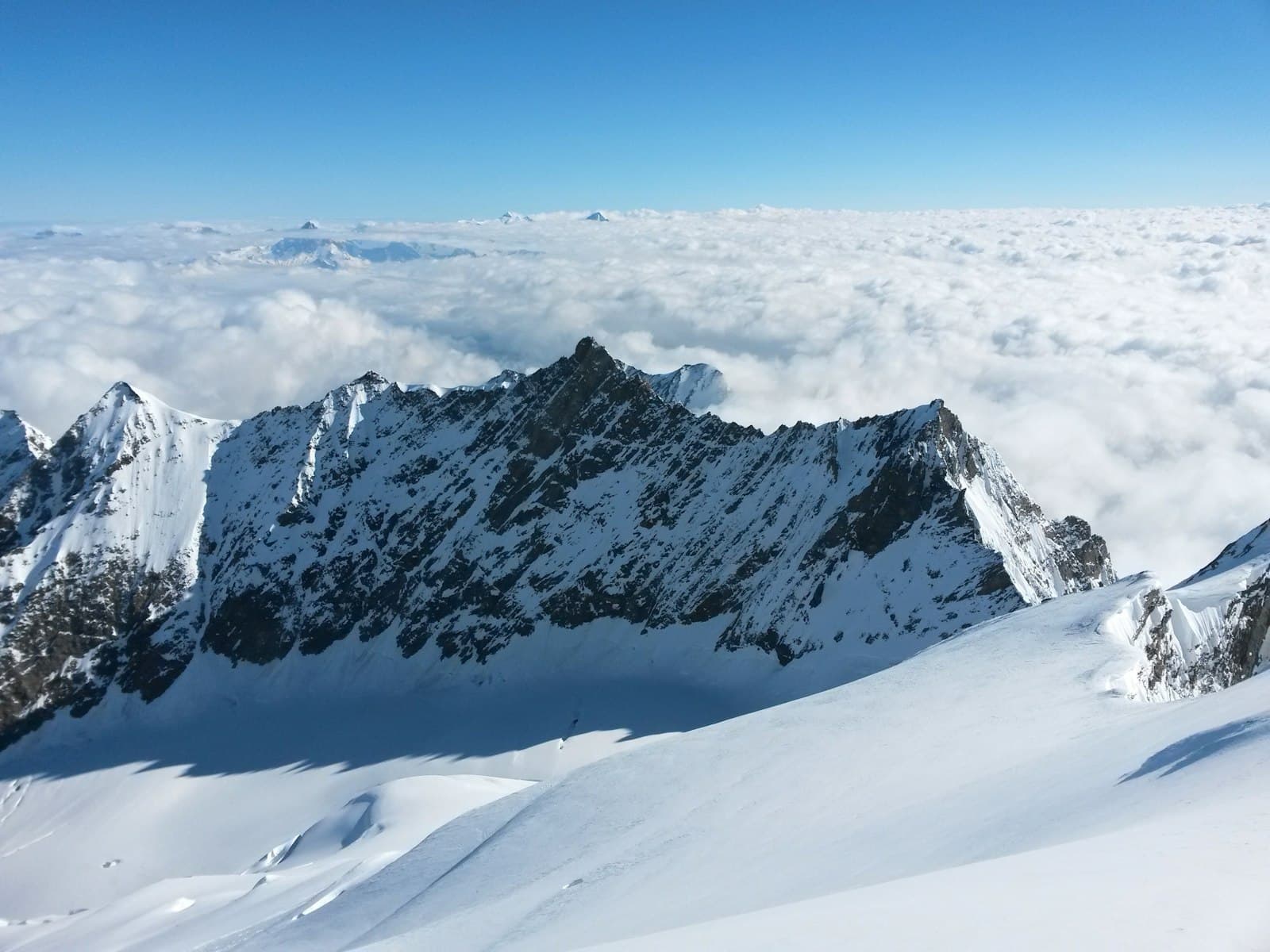 Saas-Fee — brown rocky mountain covered with snow
