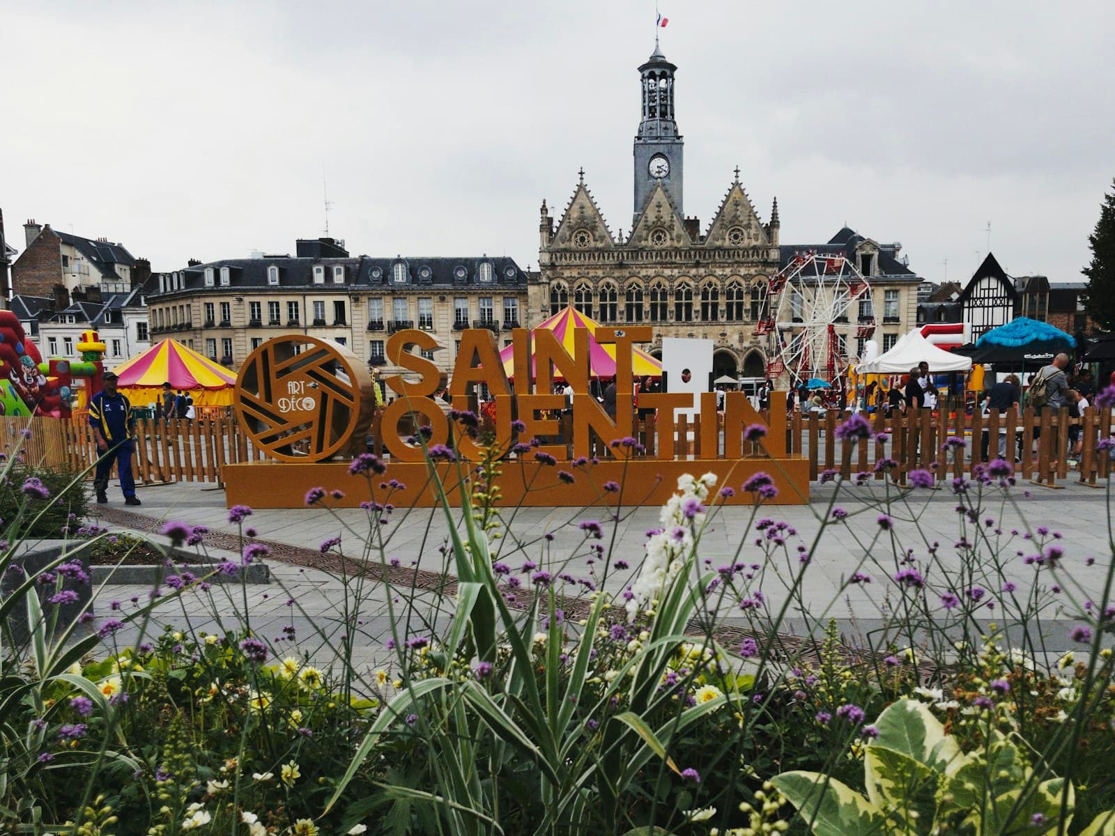 Sablé-sur-Sarthe — a large building with many colorful flags