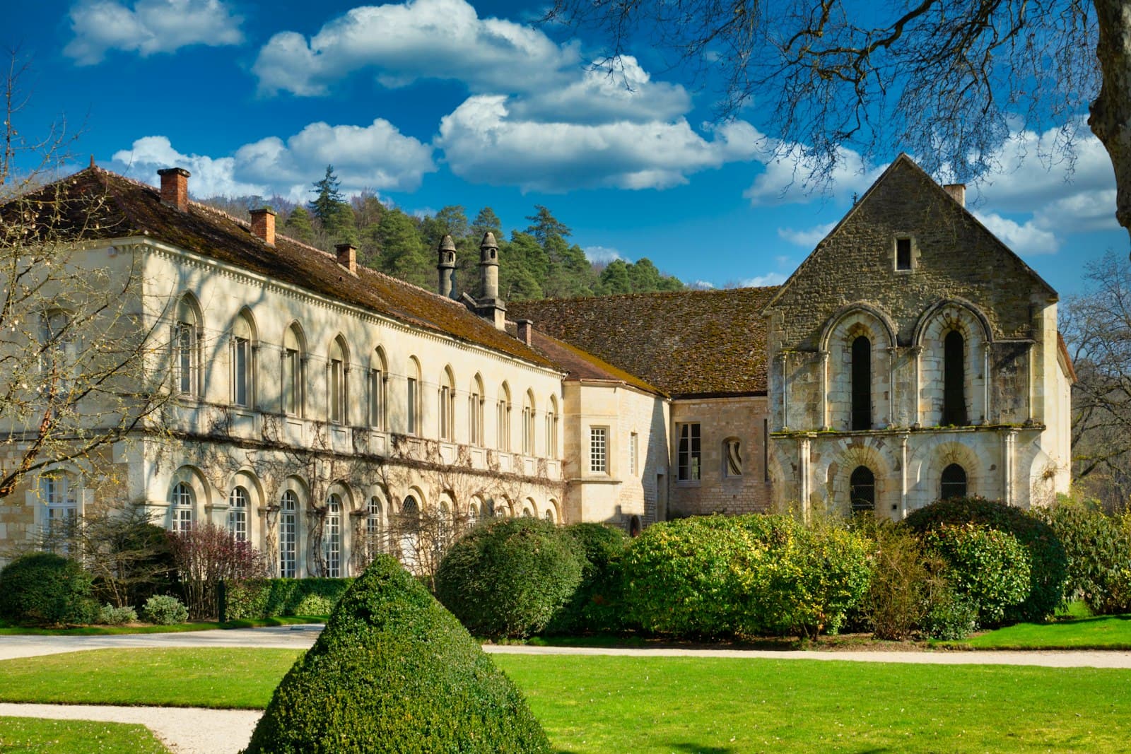 Saint-Antoine-l'Abbaye — brown concrete building near green grass field under blue sky during daytime