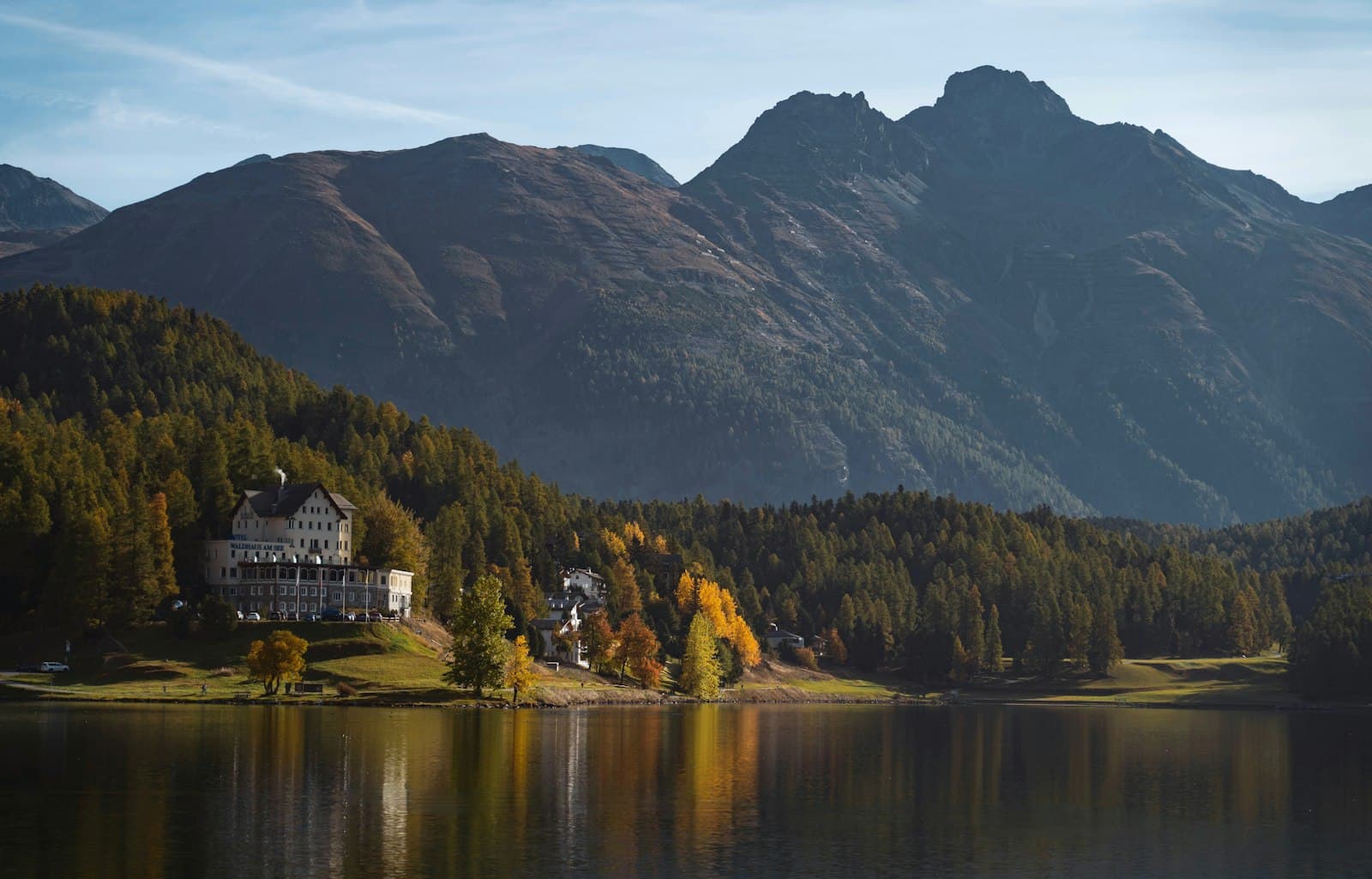 St. Moritz — a house on a lake surrounded by mountains