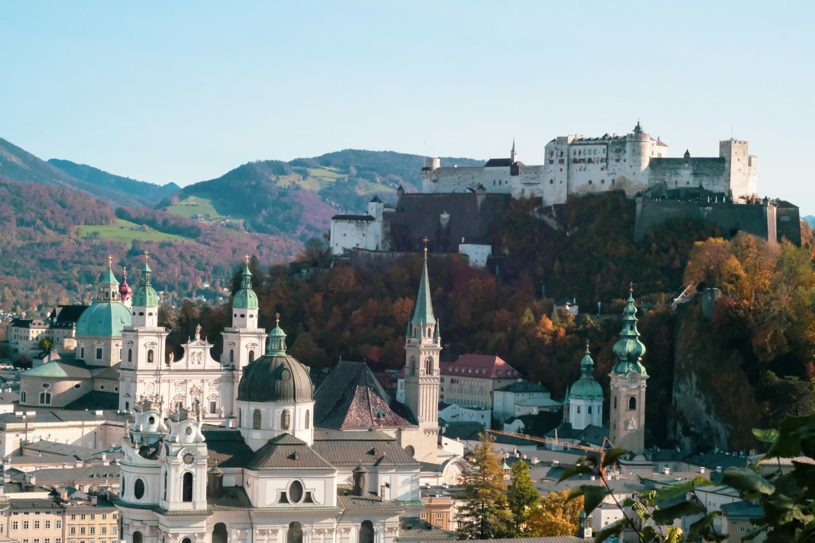 Salzburg — white and brown concrete building near green trees during daytime