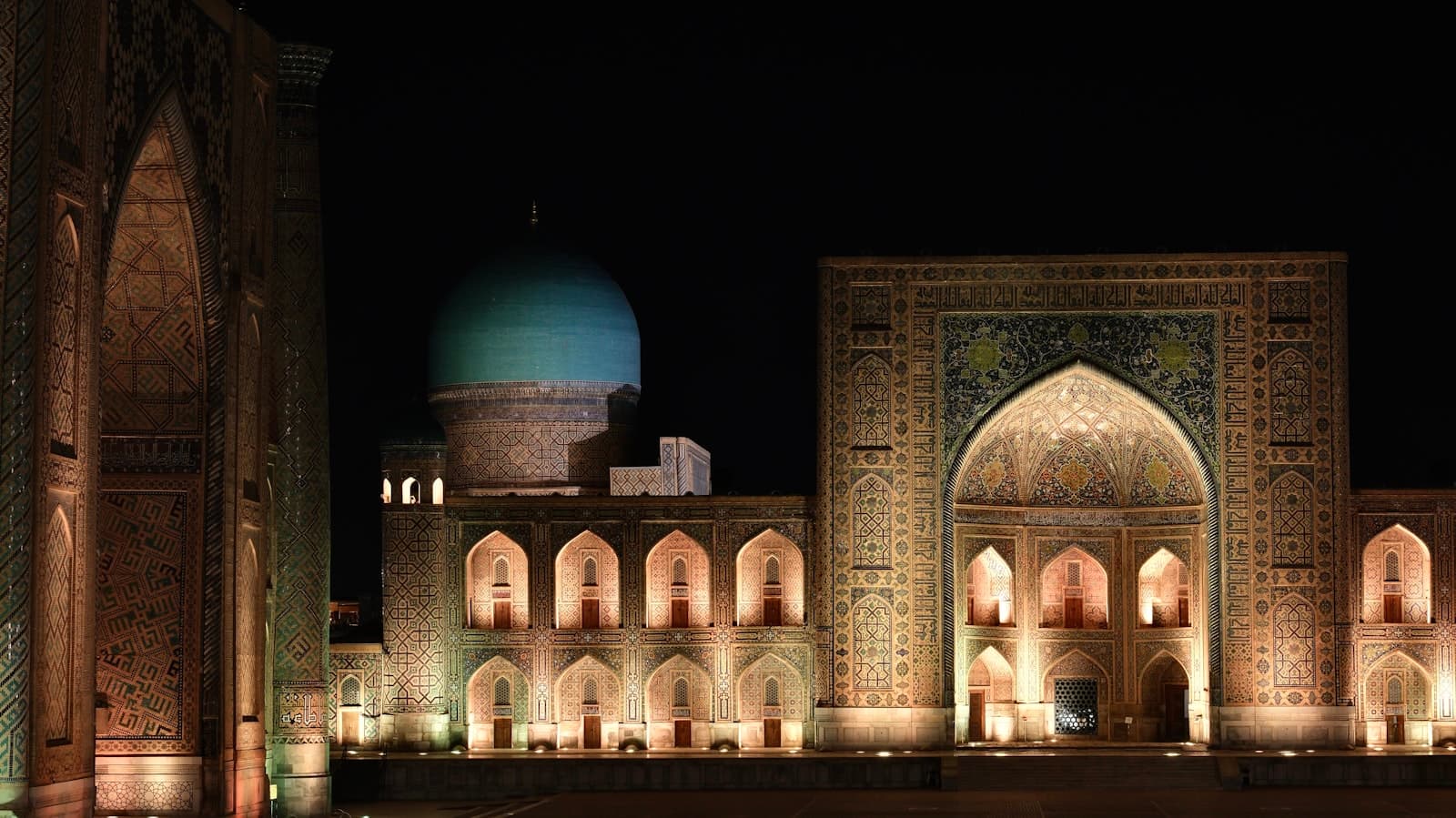Samarkand — A large building lit up at night with lights