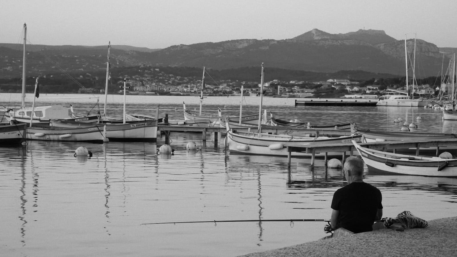 Sanary-sur-Mer — grayscale photo of boats on dock