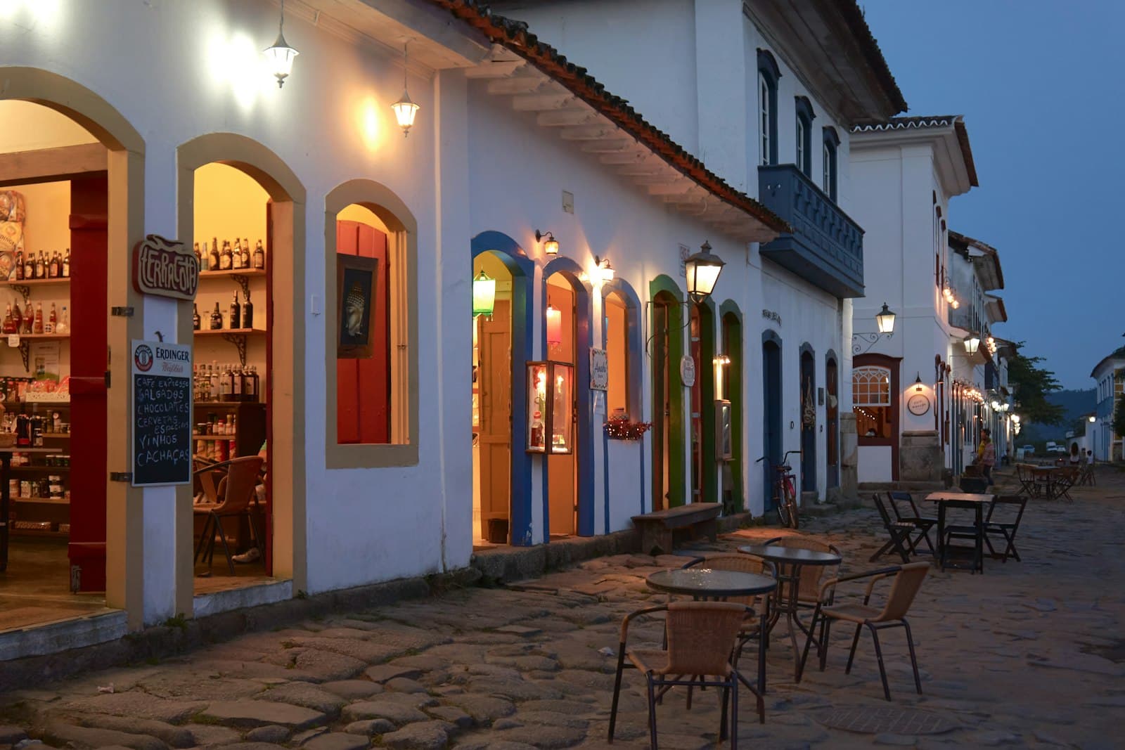 São Bento do Sapucaí — a cobblestone street lined with tables and chairs