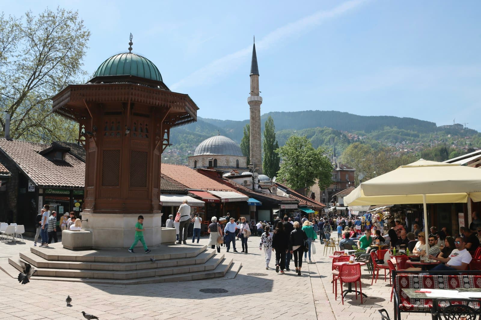 Sarajevo — a group of people walking around a town square