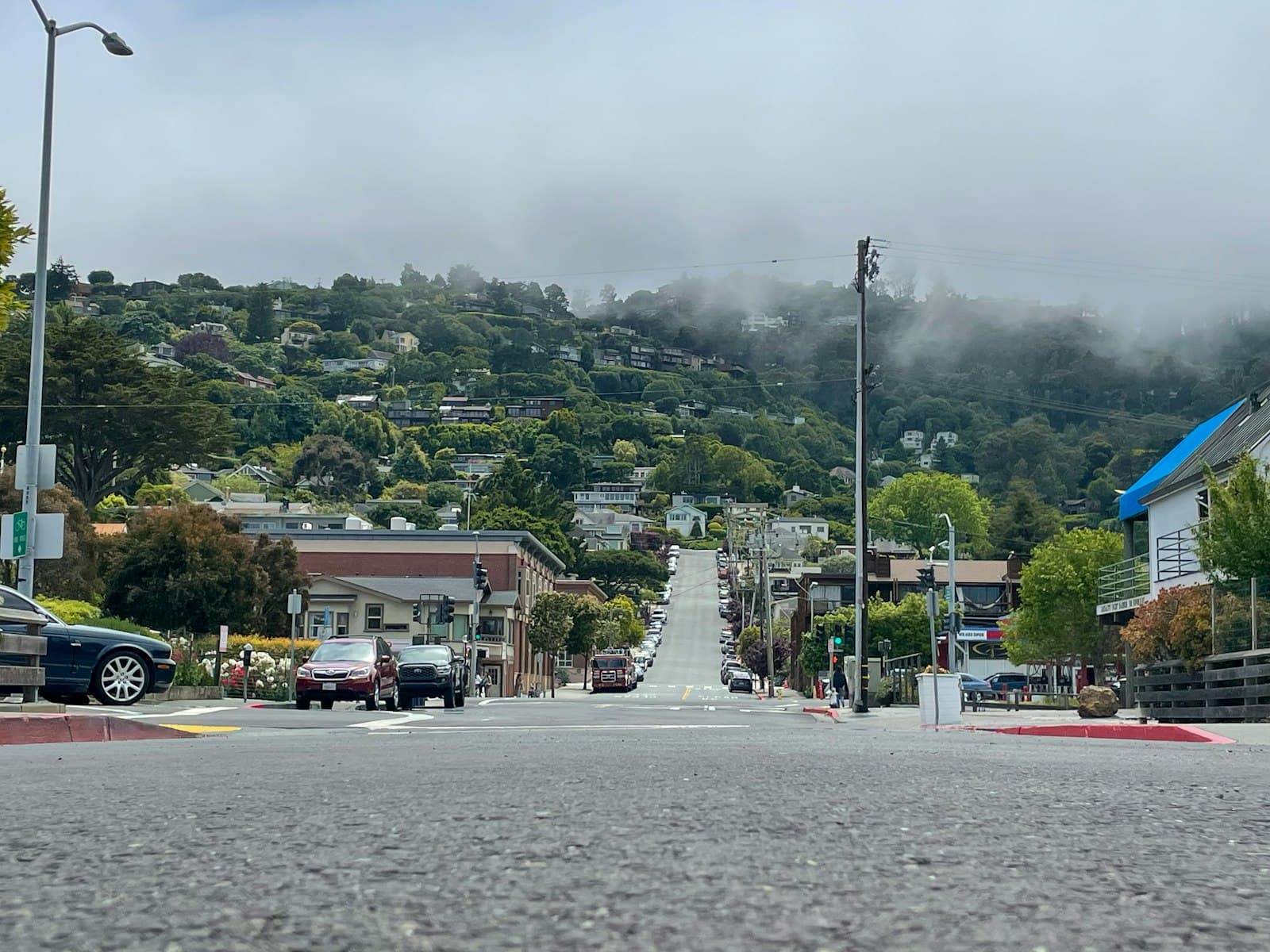 Sausalito — a city street with a hill in the background