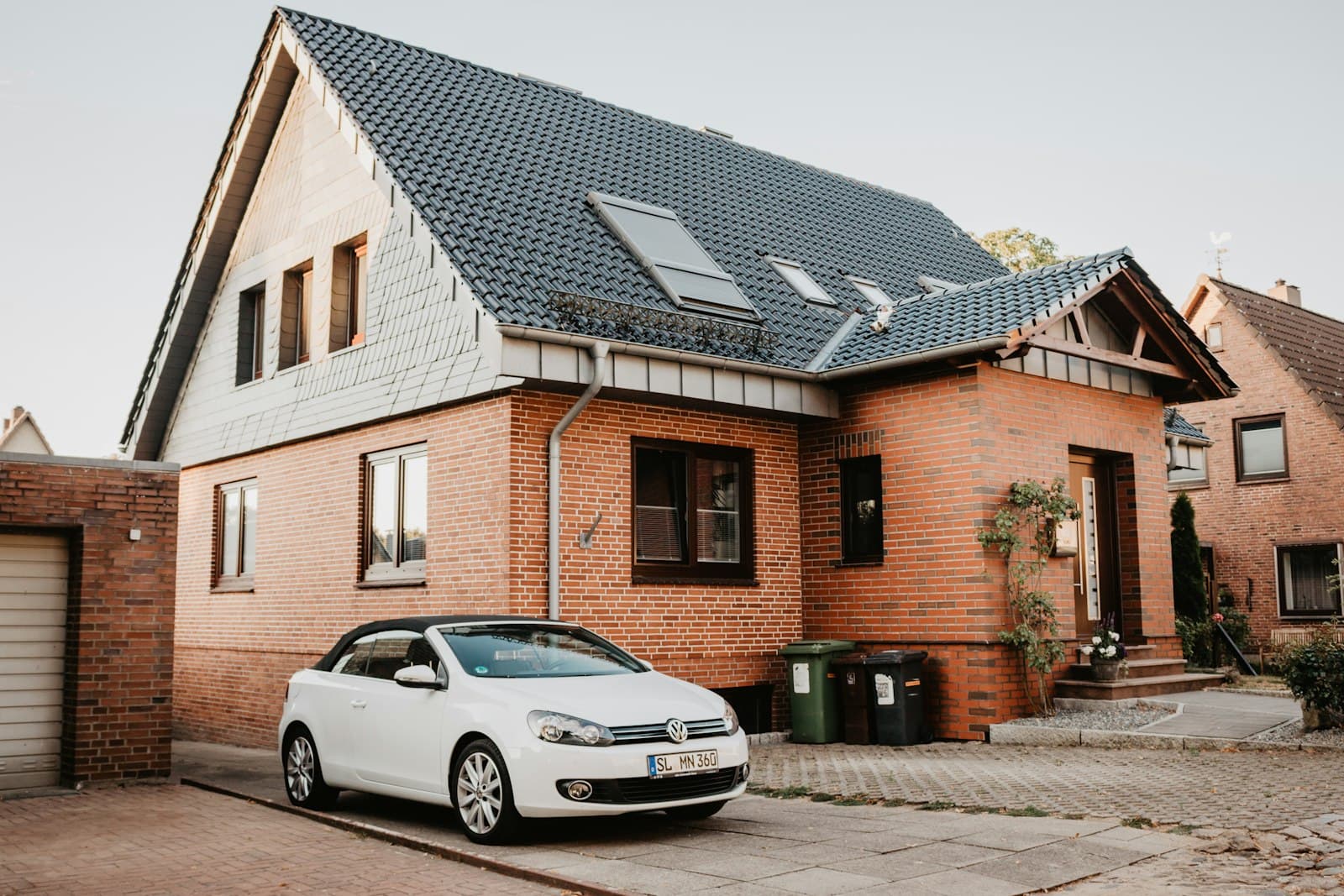 Schleswig — white Volkswagen Jetta parked beside house