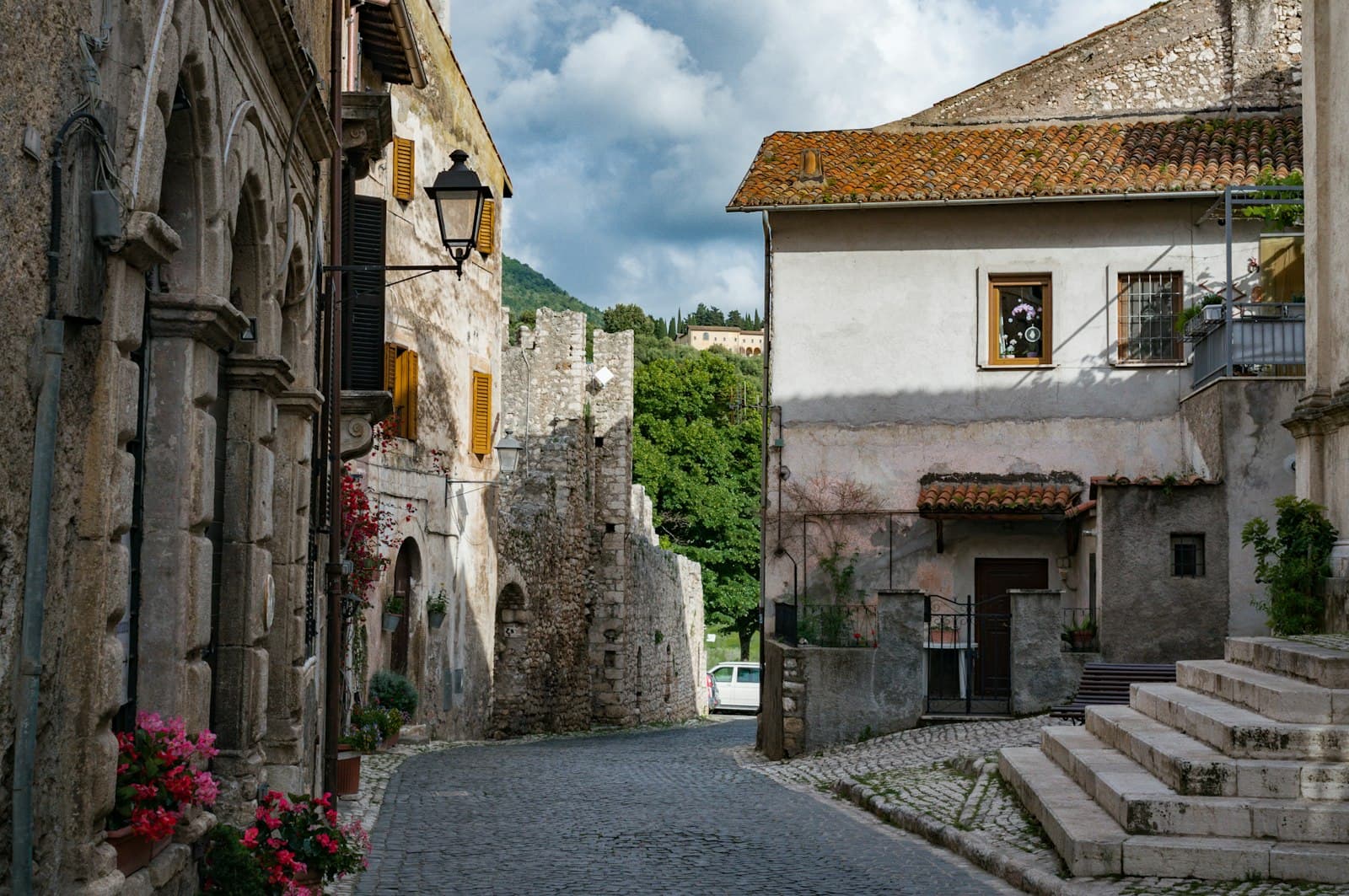 Sermoneta — a stone street with buildings on either side of it