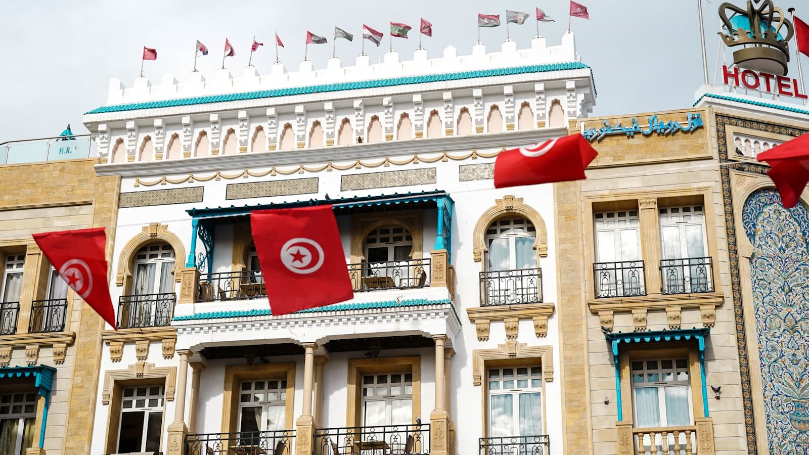 Sfax — a large building with flags flying in front of it